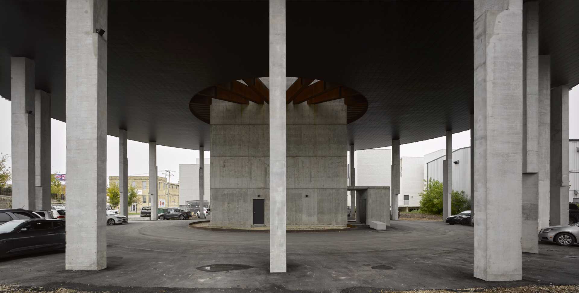 A round building with a concrete core that houses the stairs, elevator, and service shaft.