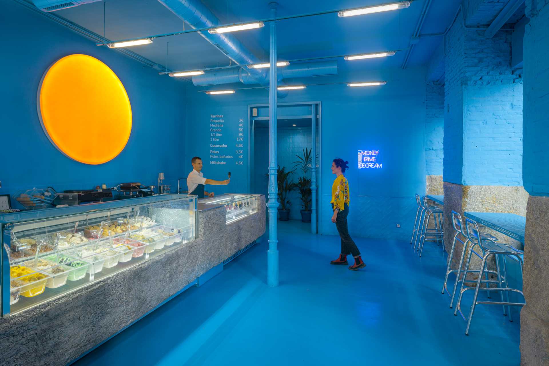 A modern ice cream shop with a bold blue interior.