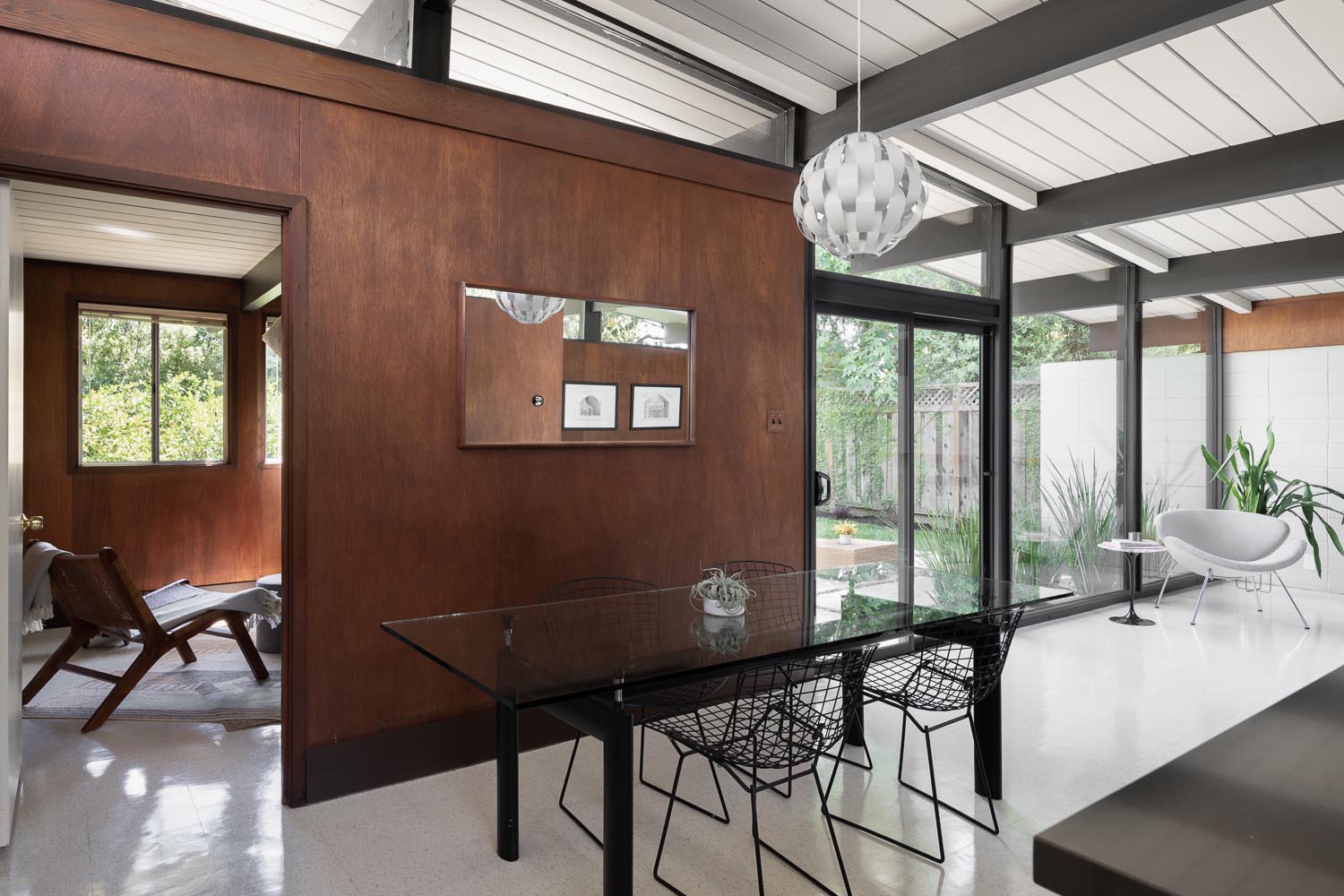 The restoration of an Eichler home included refinishing the wood panel walls.