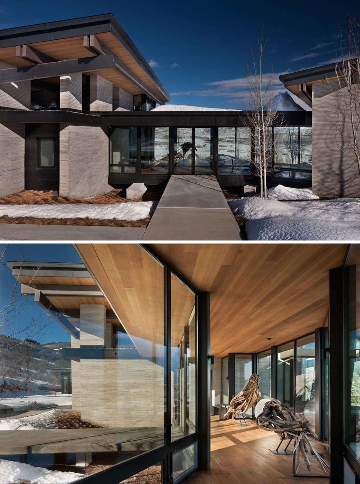 A modern house in the mountains includes cut limestone walls, wood beams, steel structure, and concrete floors.