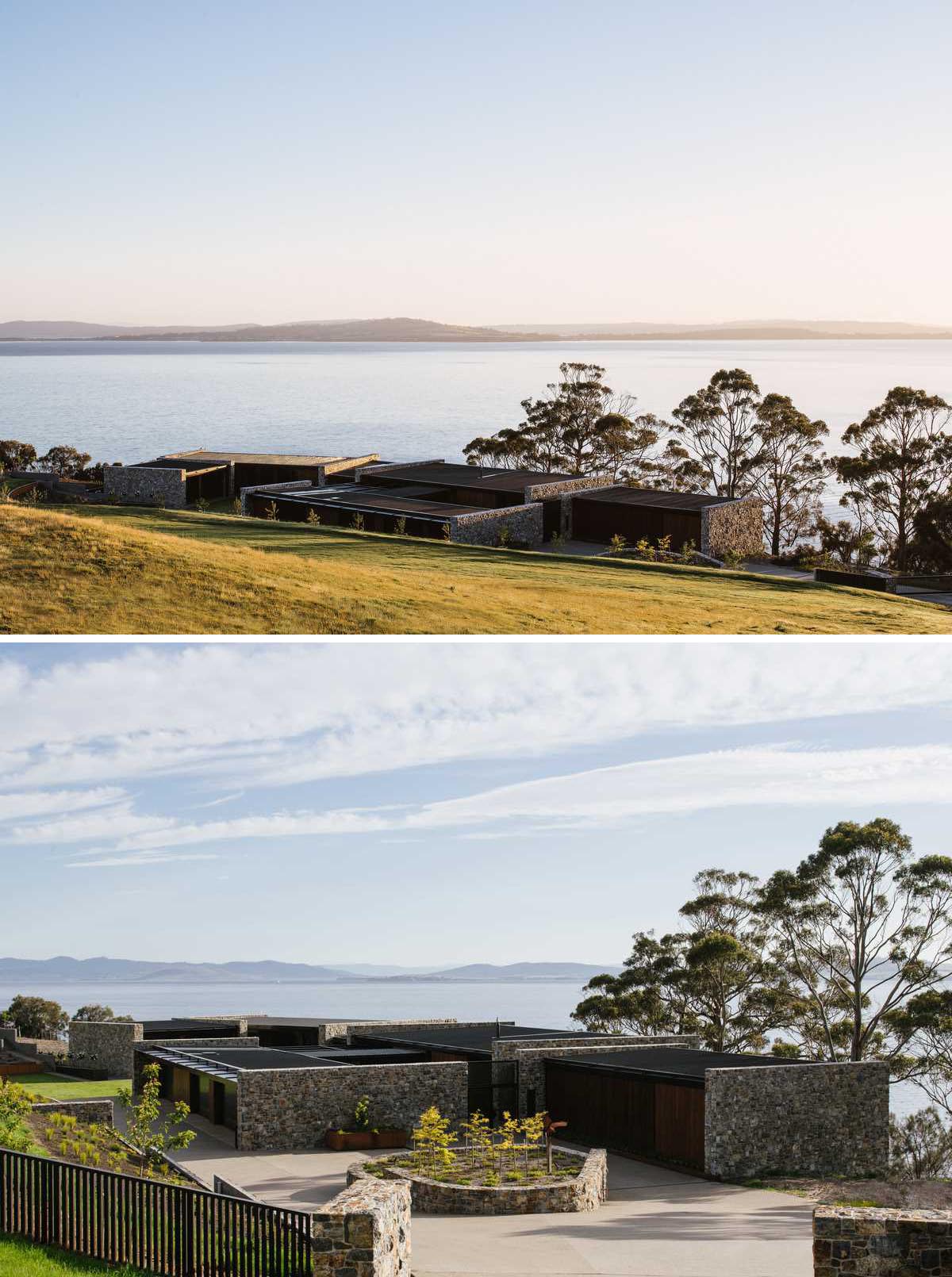 A modern house with stone walls designed to complement the landscape.