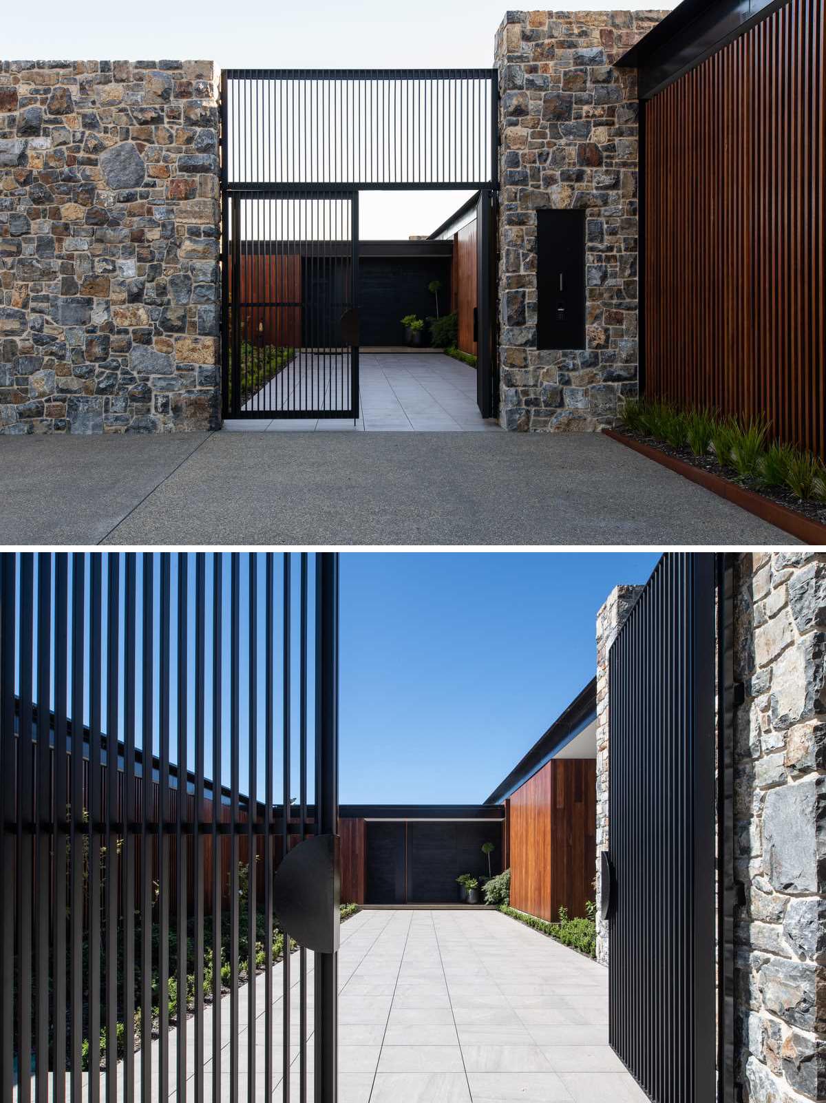 The entry gate opens up to a courtyard with low ground cover and a wide pathway.