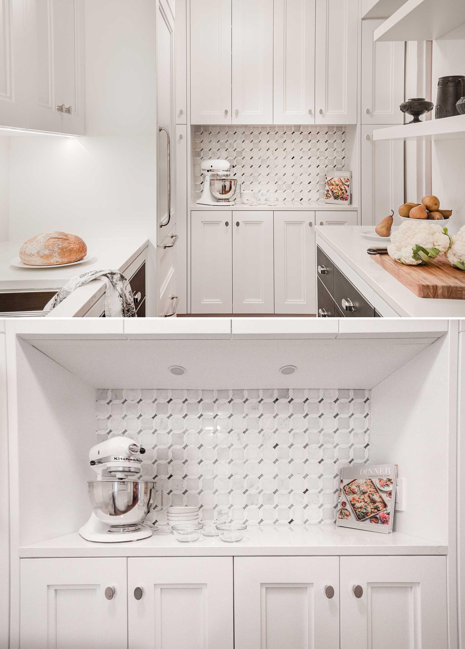 At the end of this contemporary kitchen, there's a wall of cabinetry that includes additional counterspace, while a tile backsplash in a decorative pattern creates a focal point.