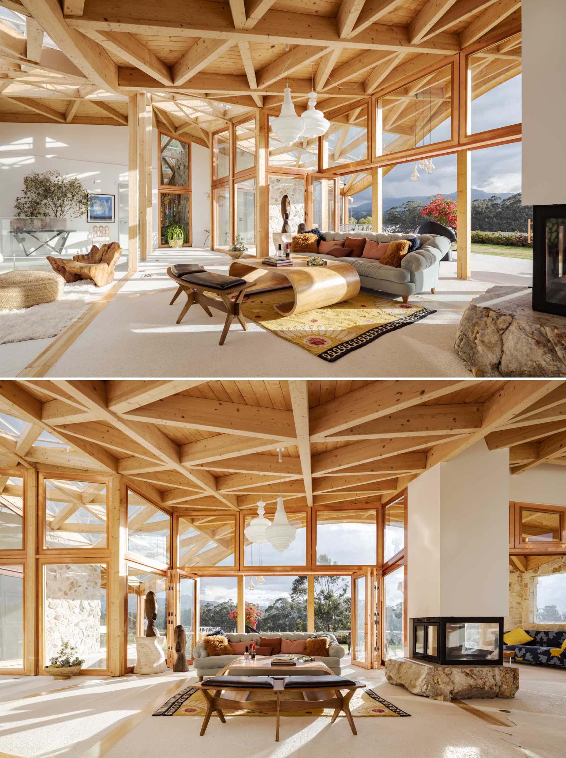 This modern living room showcases walls of glass that flood the interior with natural light, and the exposed wood ceiling.