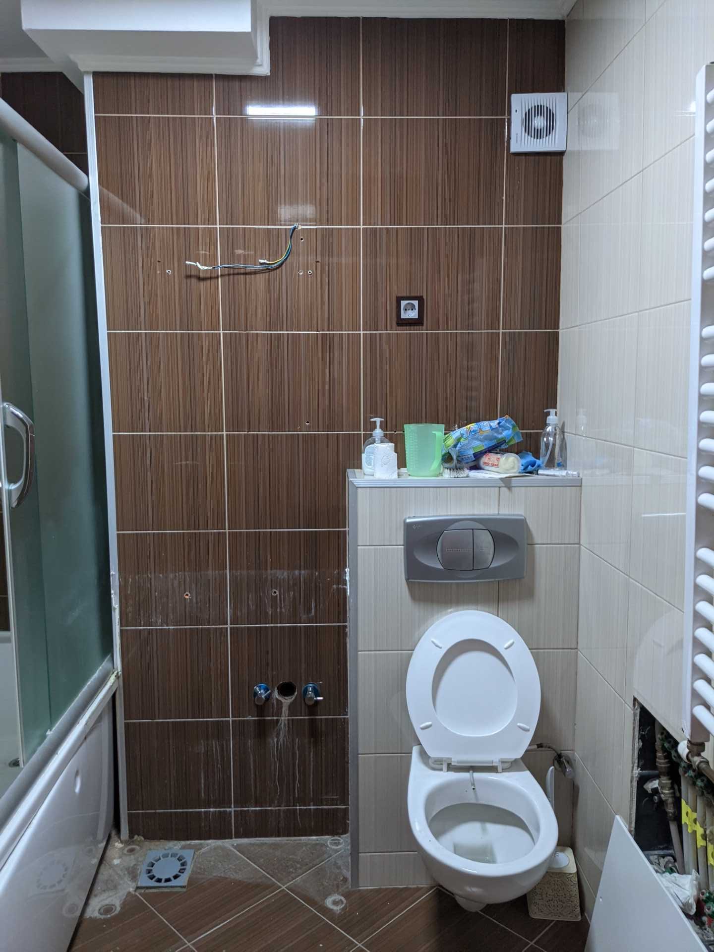 BEFORE - A dated 1960's apartment bathroom was completely gutted before being transformed into an apartment full of color.