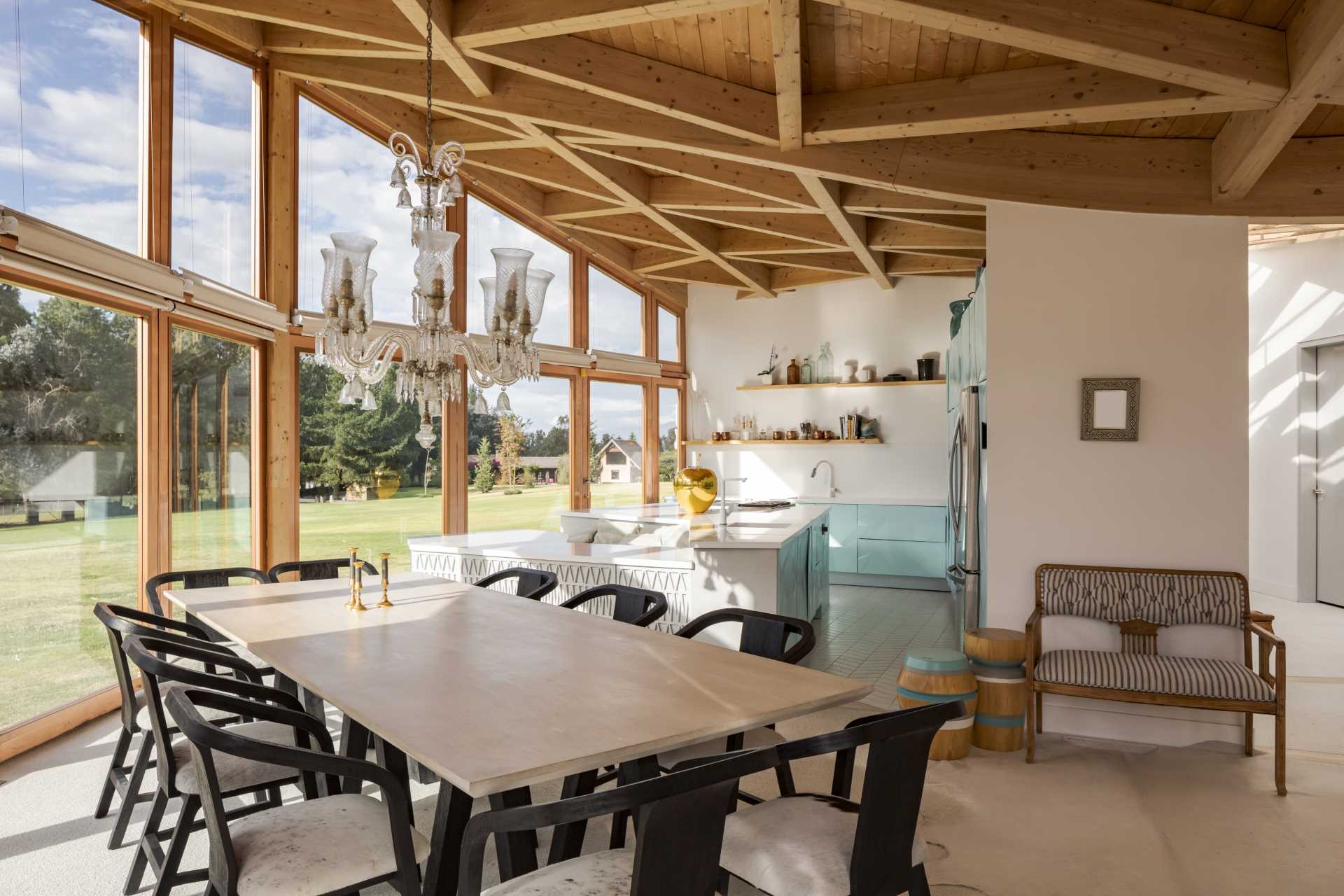 This dining room is open to the kitchen. Both of which have views of the lawn outside.