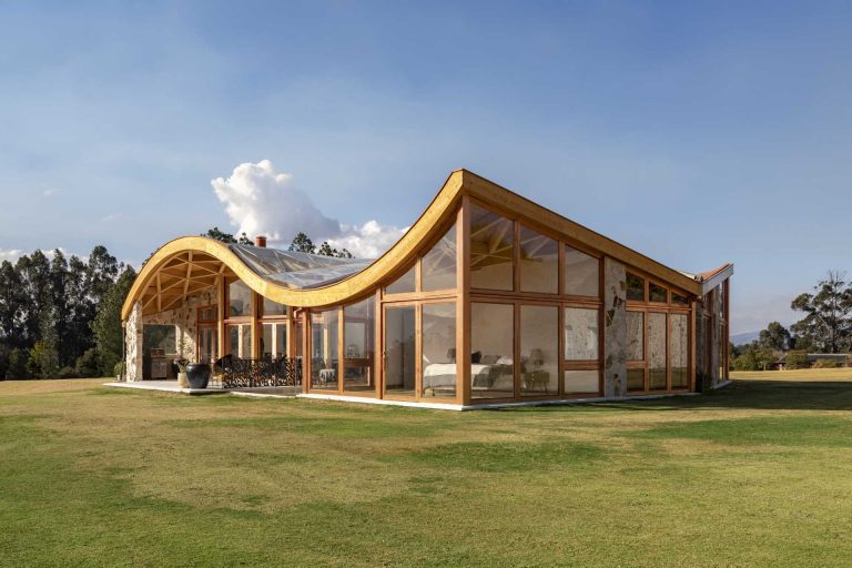 The Wavy Roof On This House Also Has An Exposed Wood Structure On The Interior