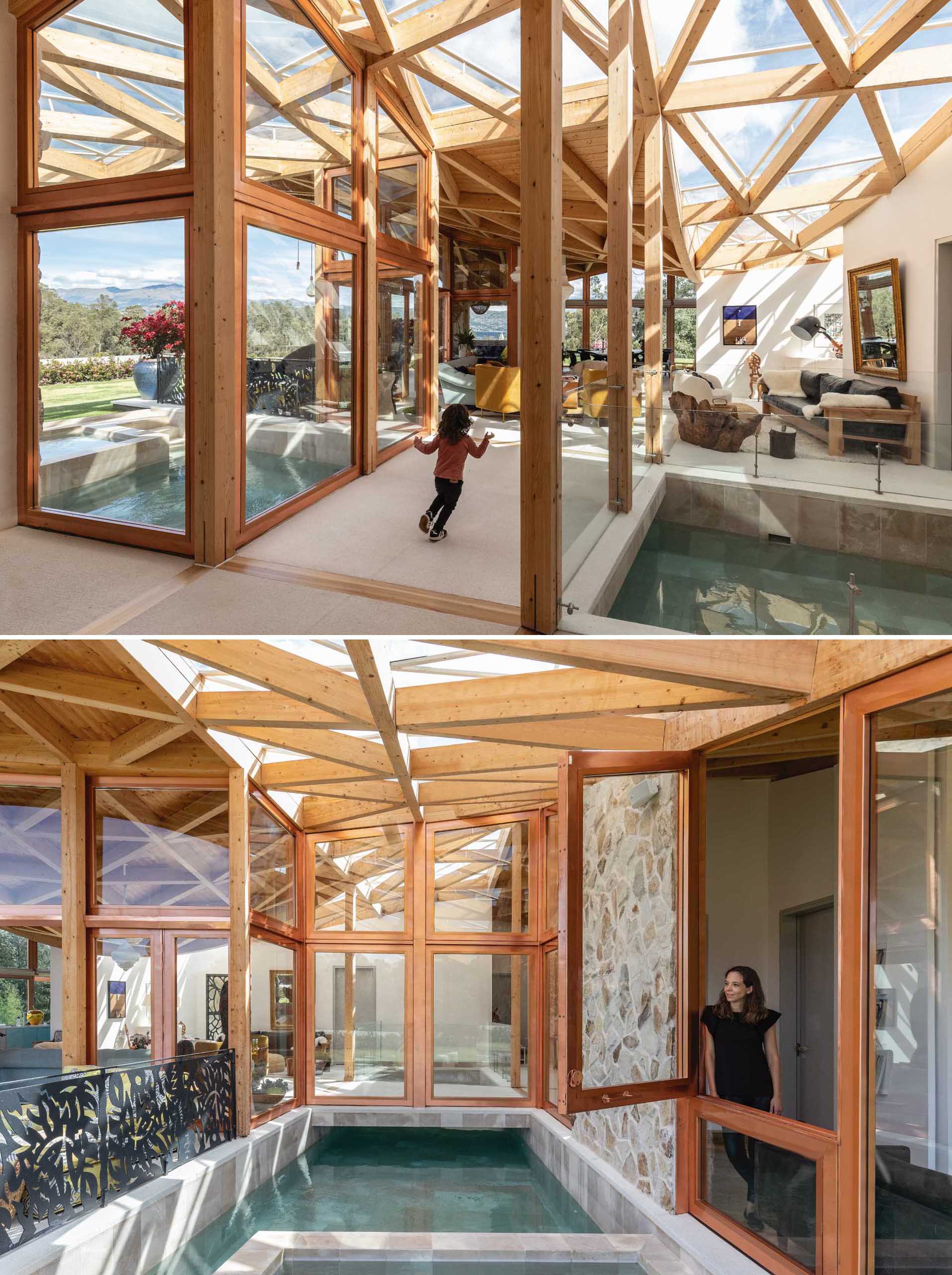 A modern wooden home with a walkway that passes over an indoor swimming pool.