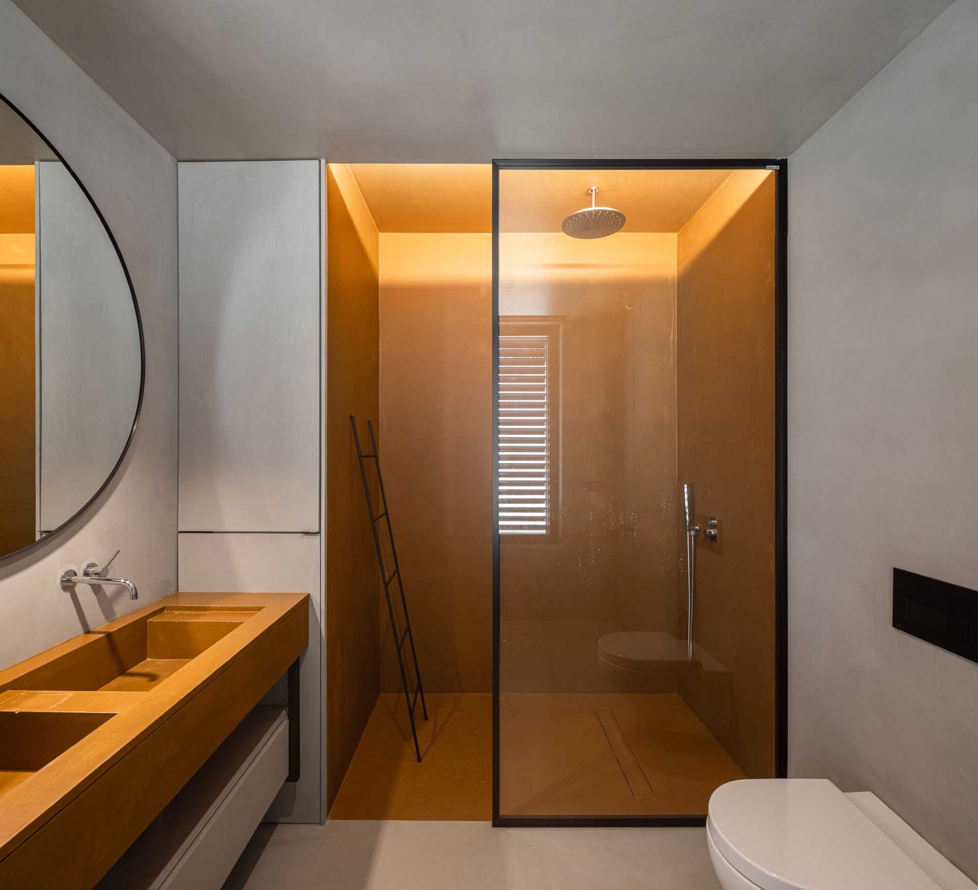 A modern bathroom with a walk-in shower.