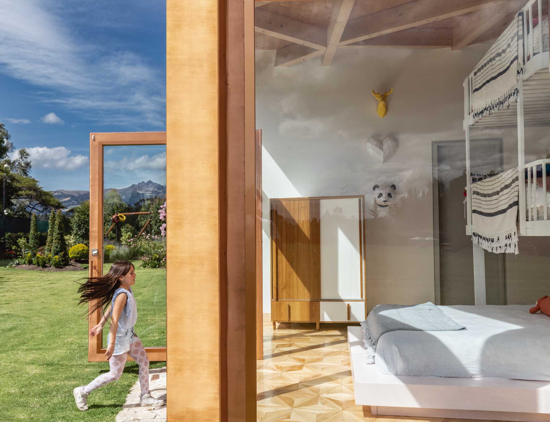 A kids bedroom with floor-to-ceiling windows.