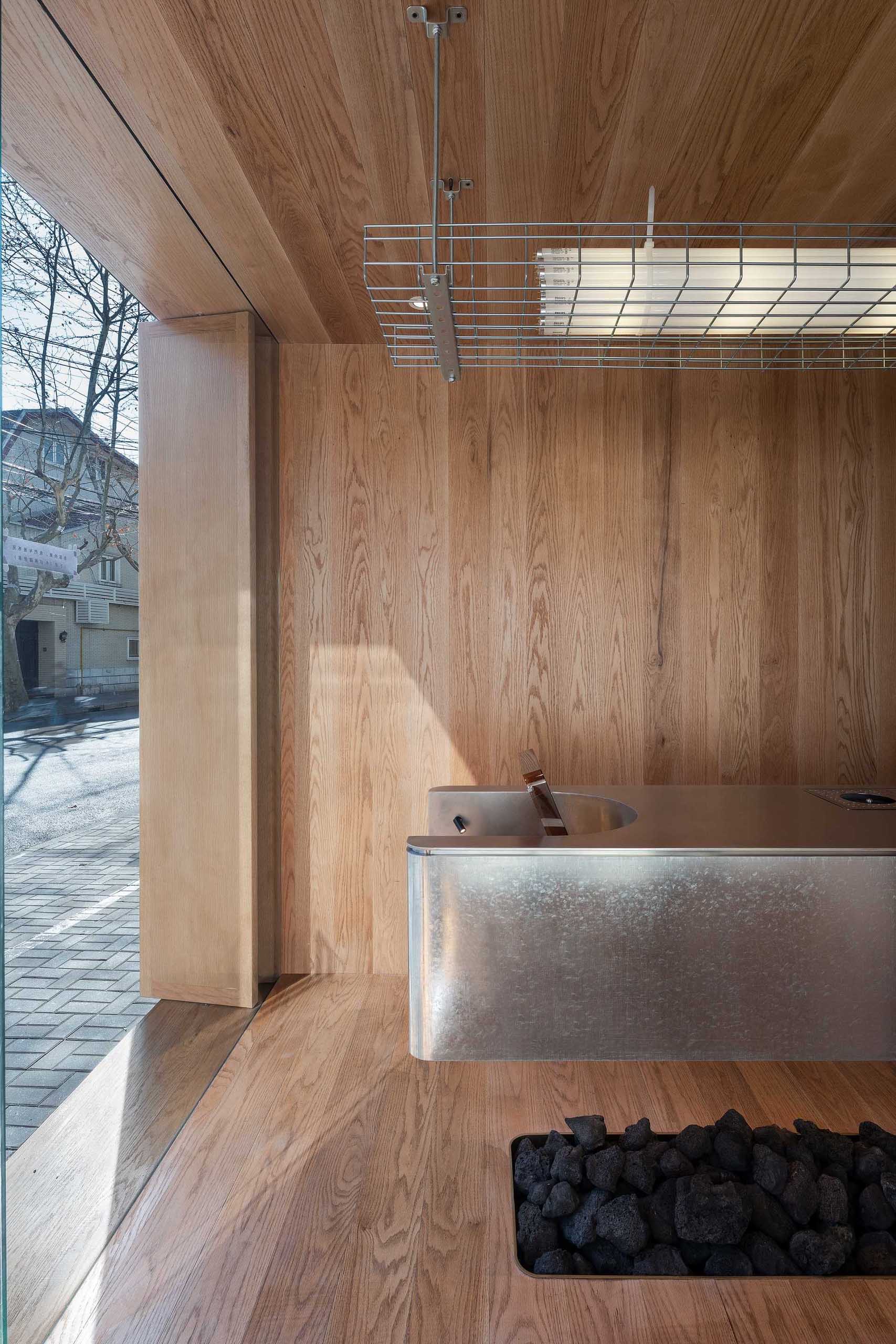 A modern coffee shop with a galvanized steel countertop.