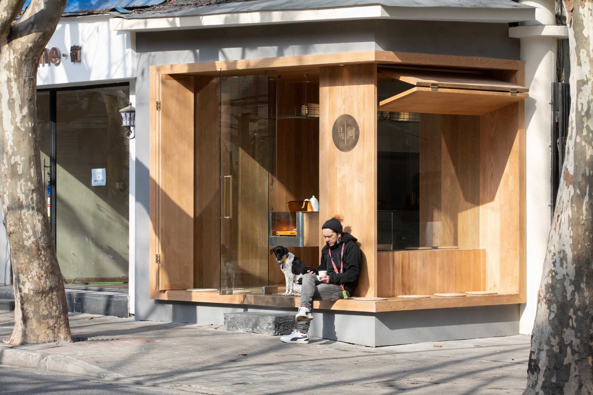 A modern coffee shop that opens to the street.