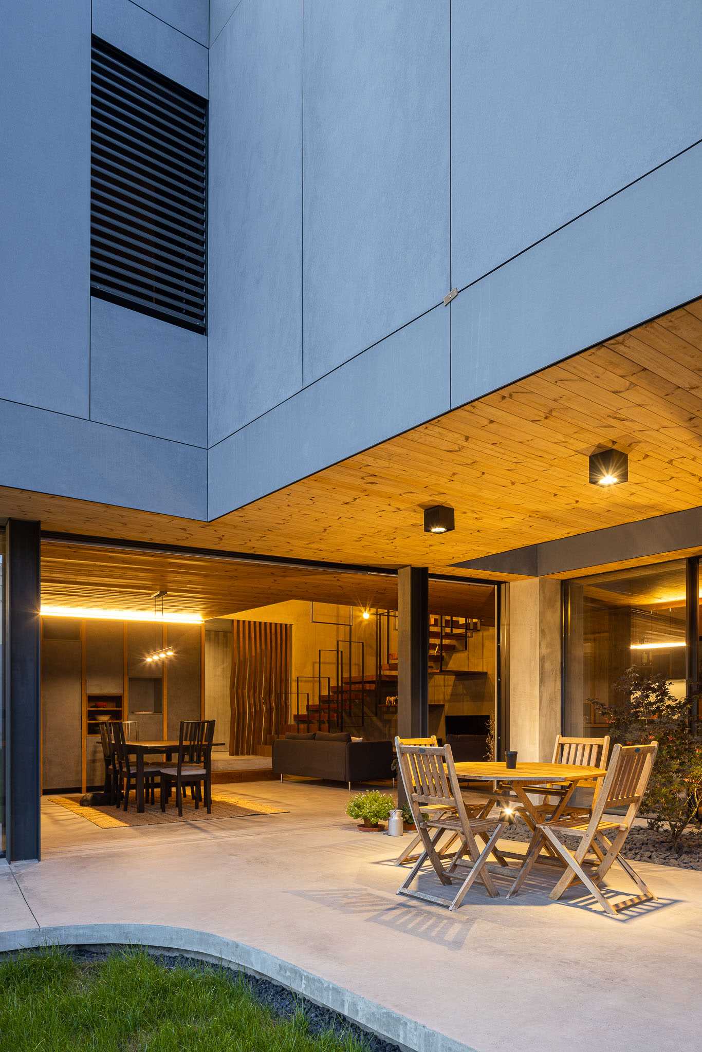 A dining room that opens up to a patio.