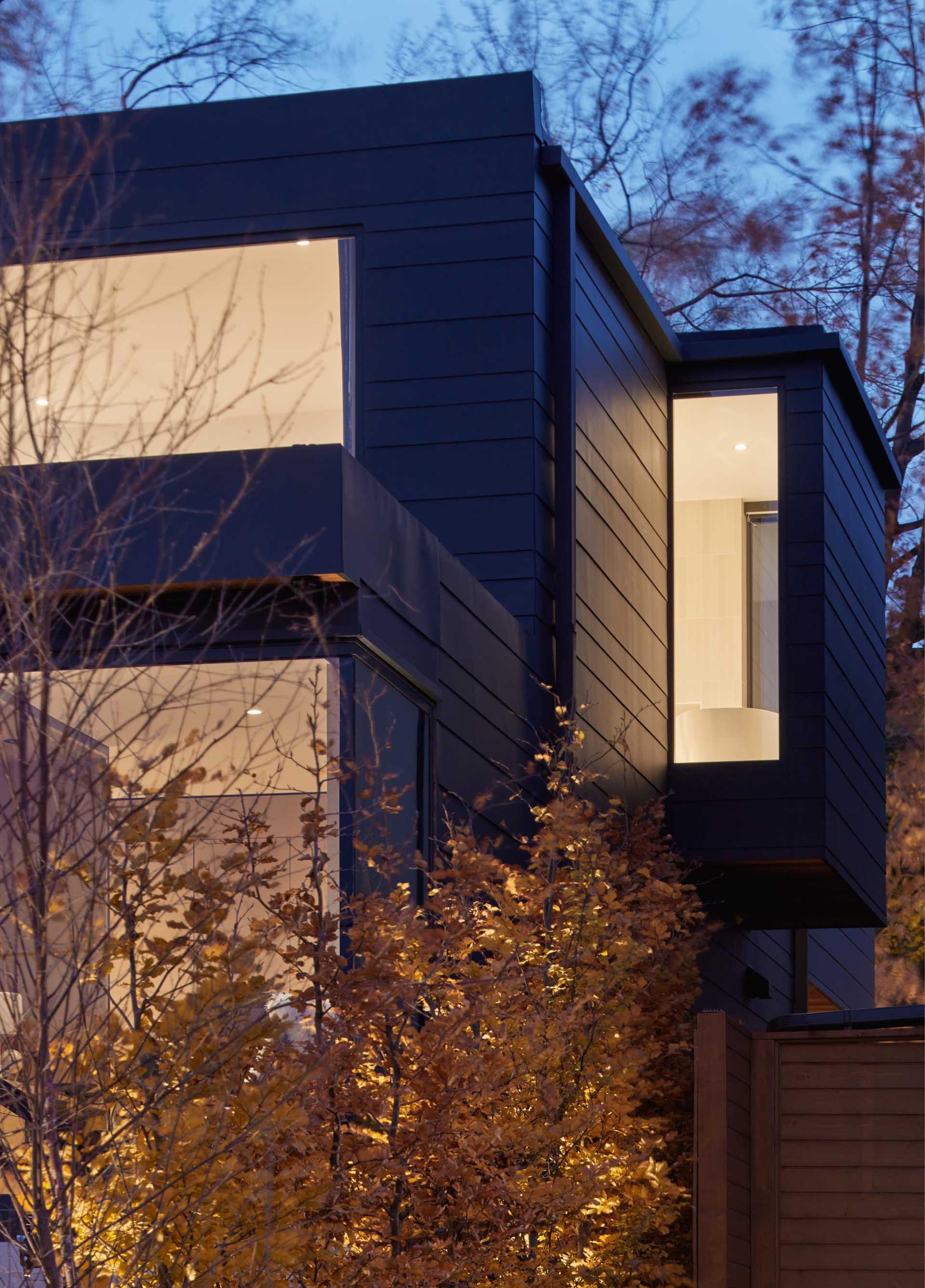 A modern farmhouse inspired home with charred wood siding.