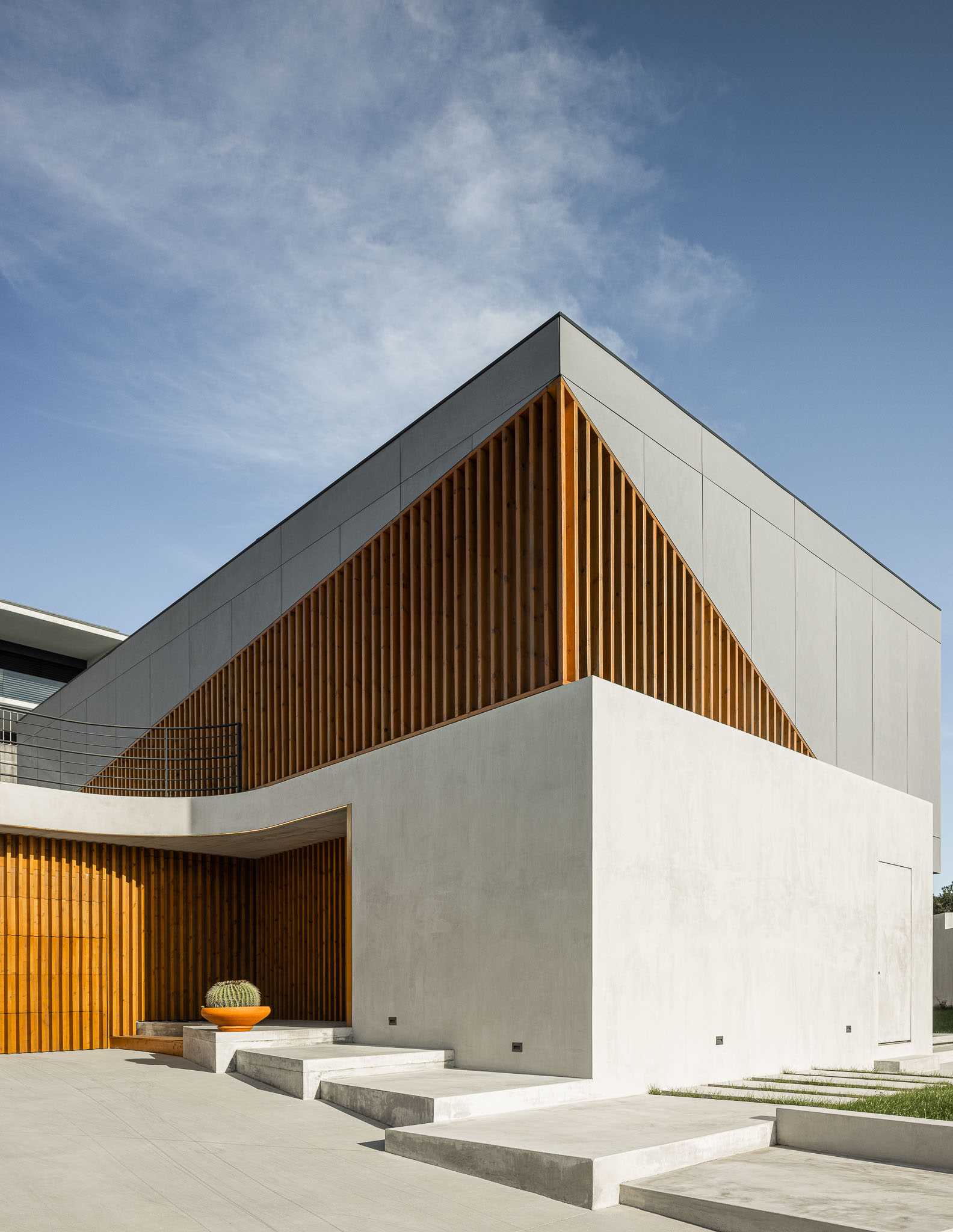 A modern house with wood slat accents on the exterior.