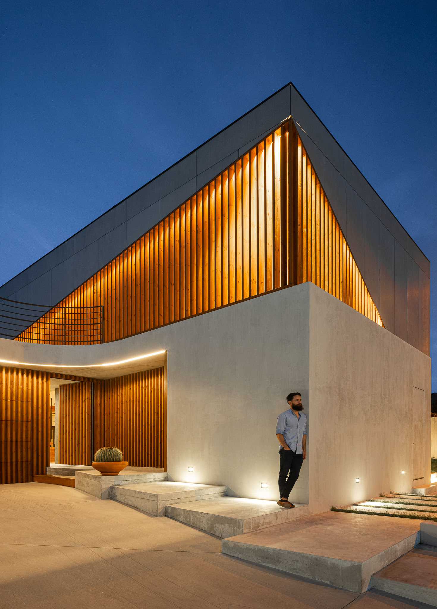 A modern house with exterior lighting.