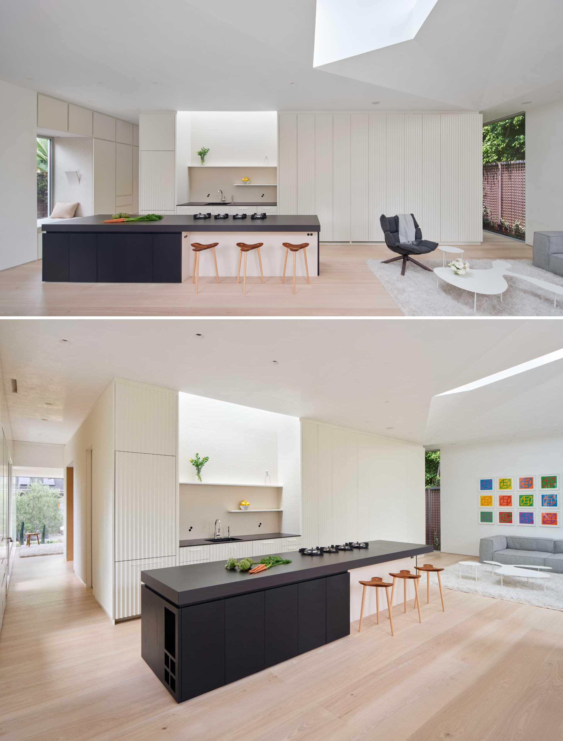 This modern kitchen includes a large 11 foot island with a Neolith sintered porcelain countertop. A trio of stools made from walnut and maple add a natural element.