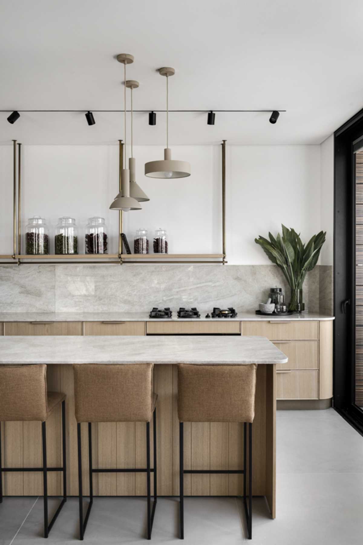 A modern kitchen with a natural color palette.