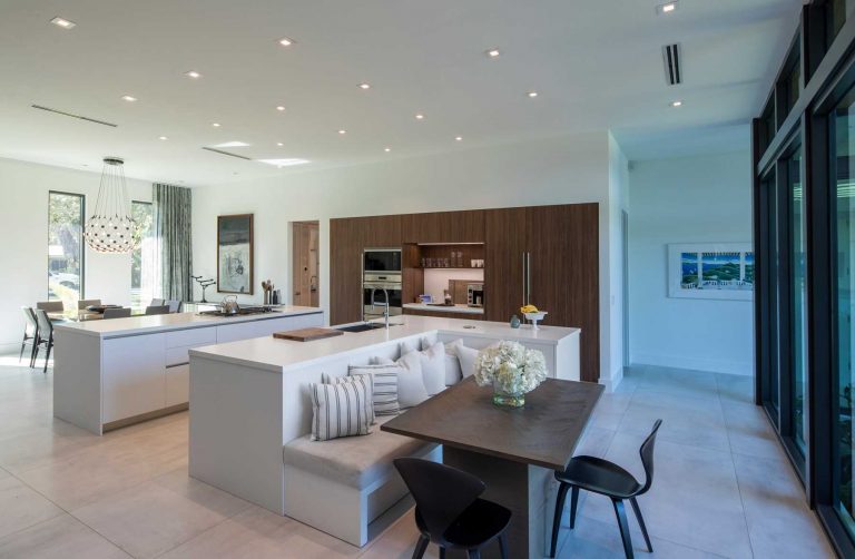 An L-Shaped Kitchen Island Is A Creative Way To Include Seating And A Table