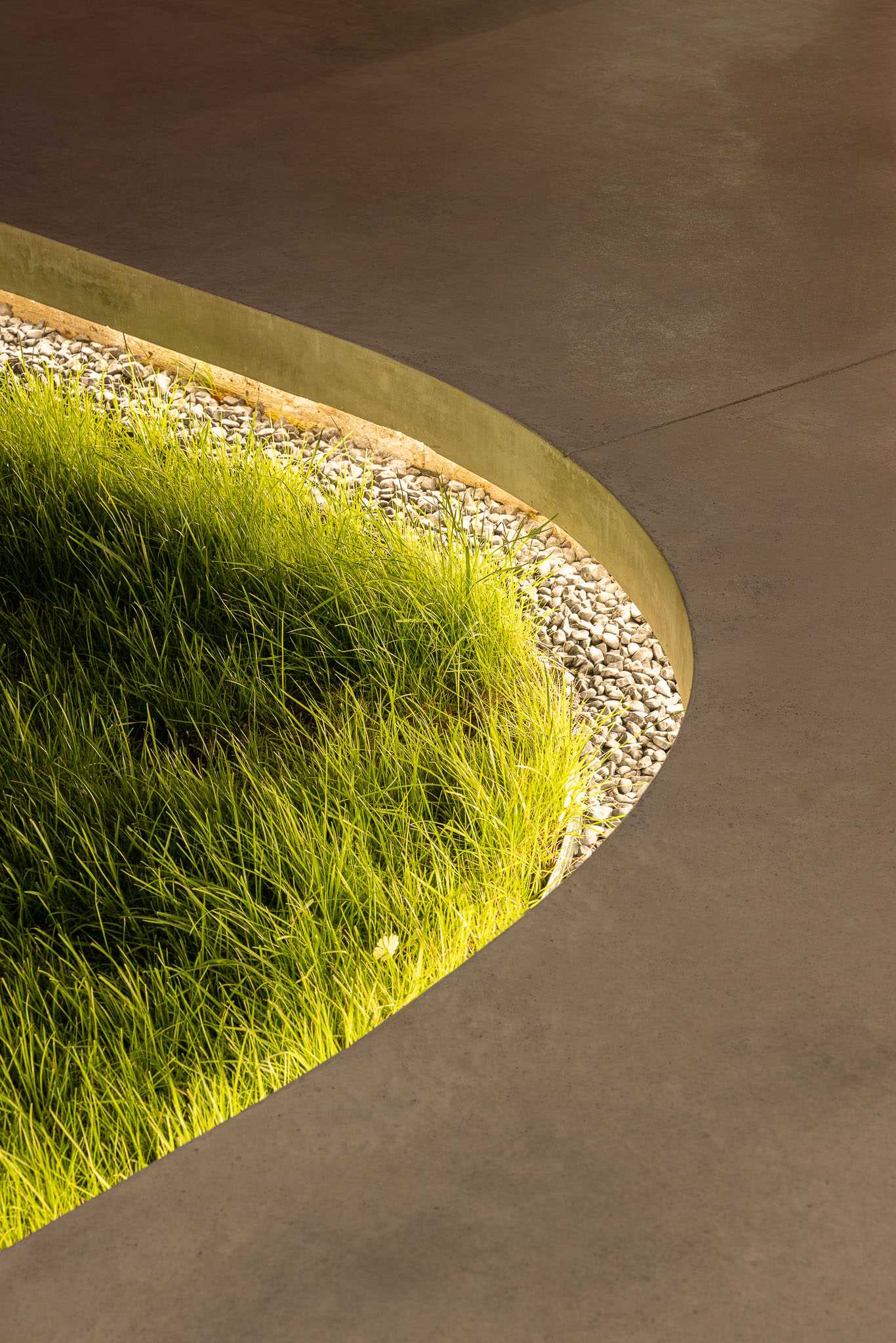 A modern concrete patio with hidden lighting.