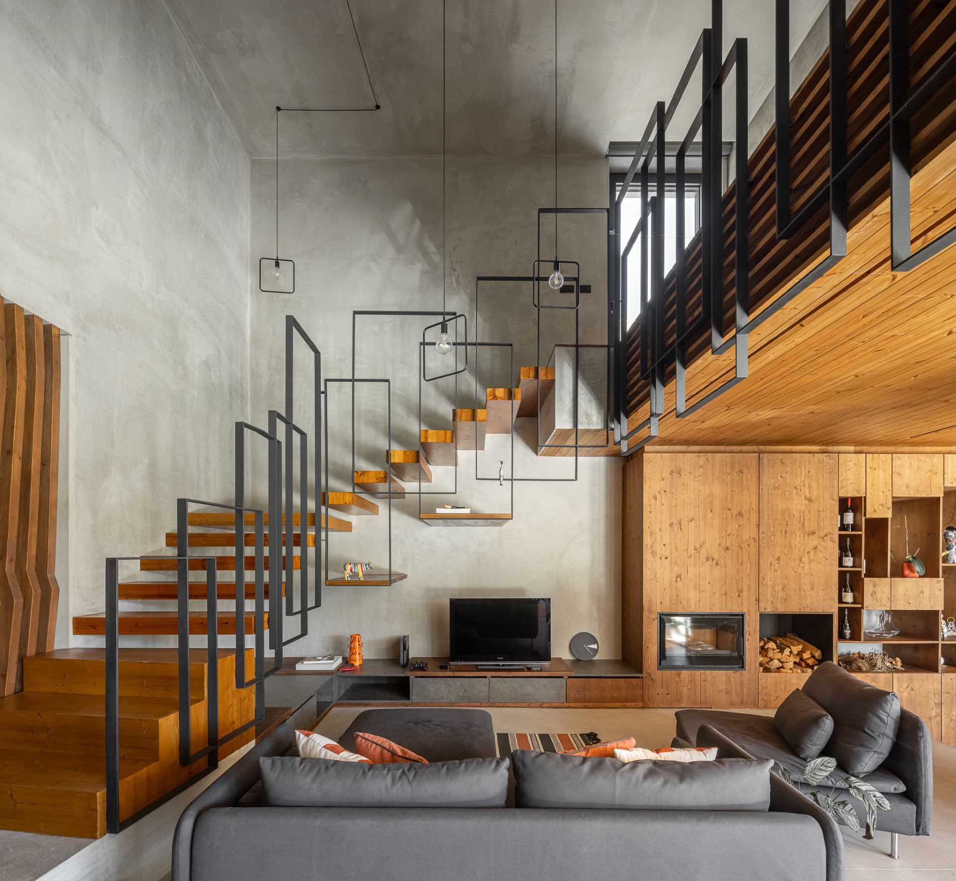 A modern living room with views of the floating stairs.