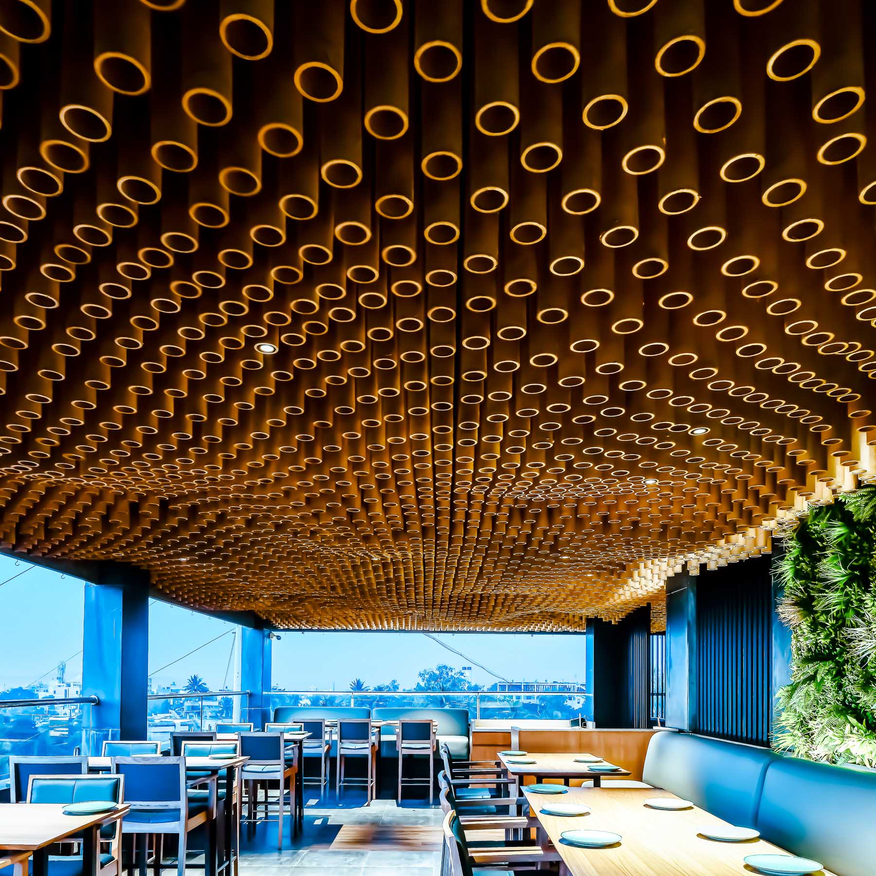 This modern restaurant includes 20521 paper tubes hung from the ceiling in a parametric installation.