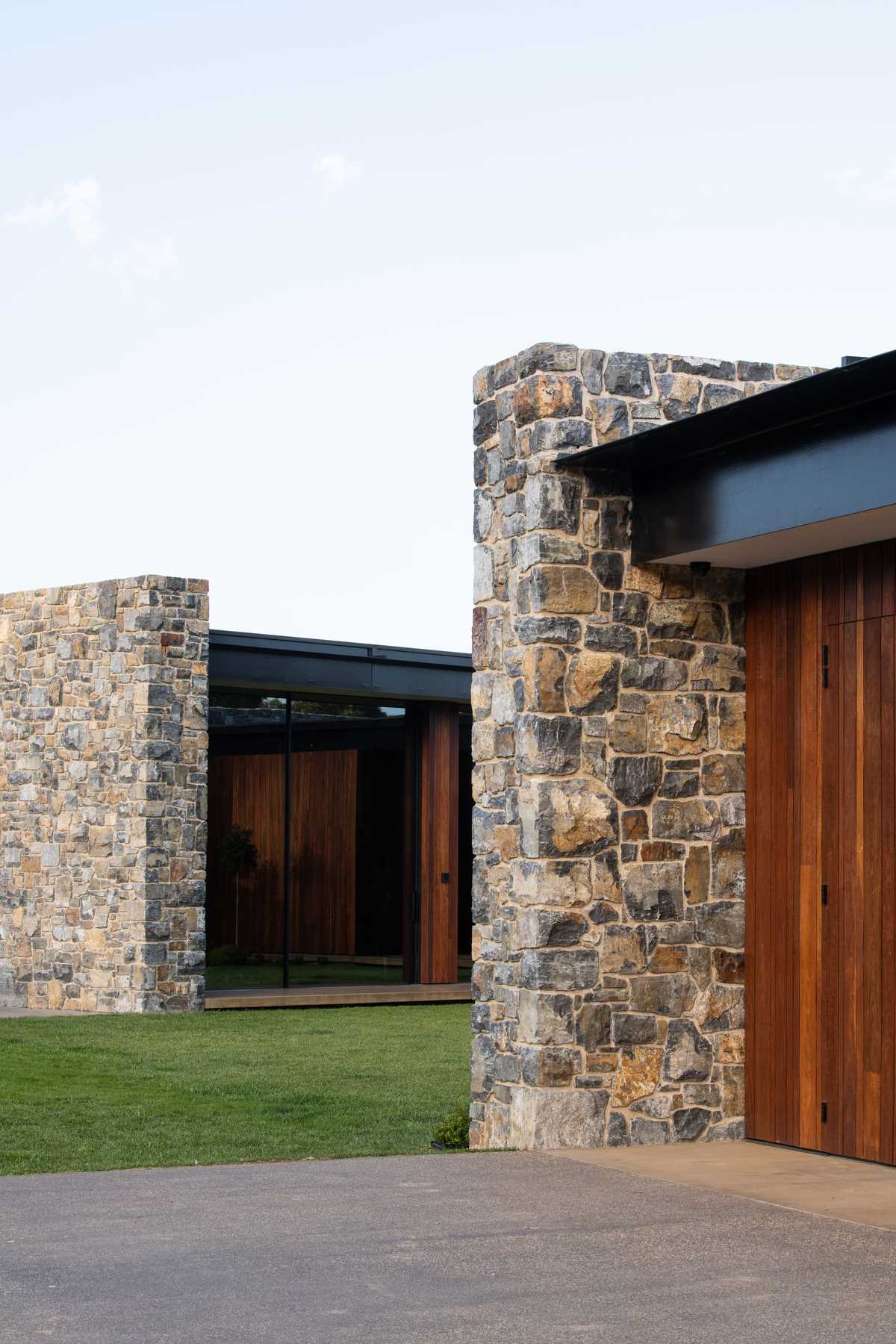 Mudstone walls were chosen as the core material for this modern house.