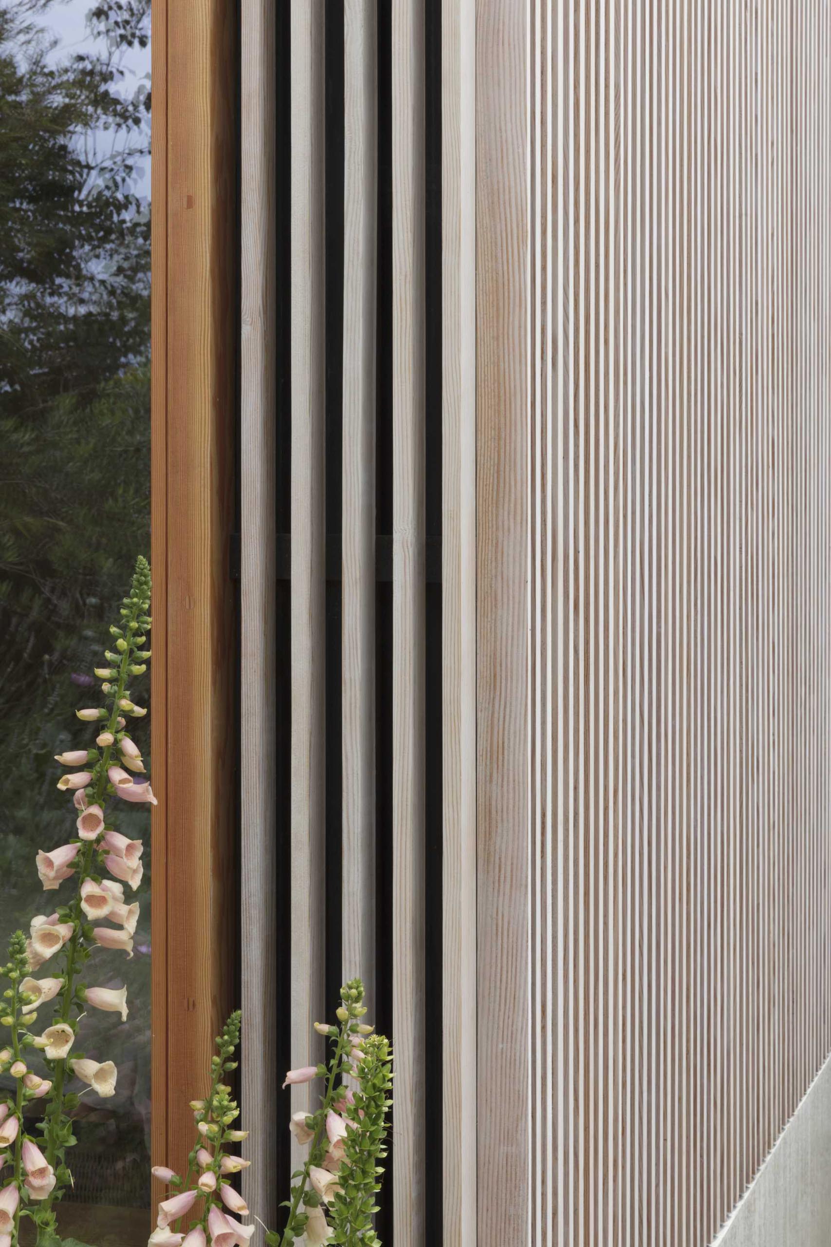A modern home addition covered in wood slats made from Douglas Fir.