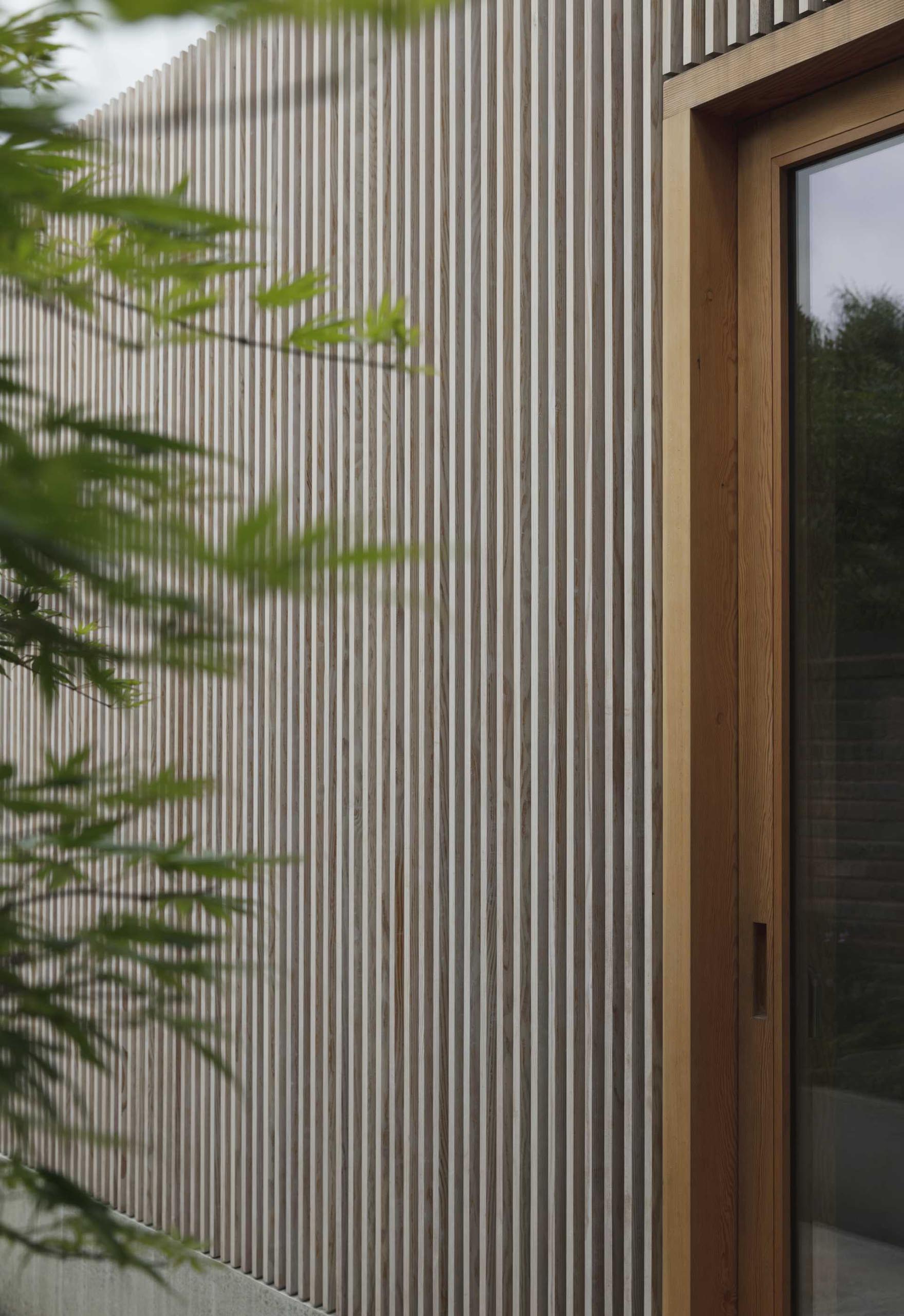 A modern home addition covered in wood slats made from Douglas Fir.