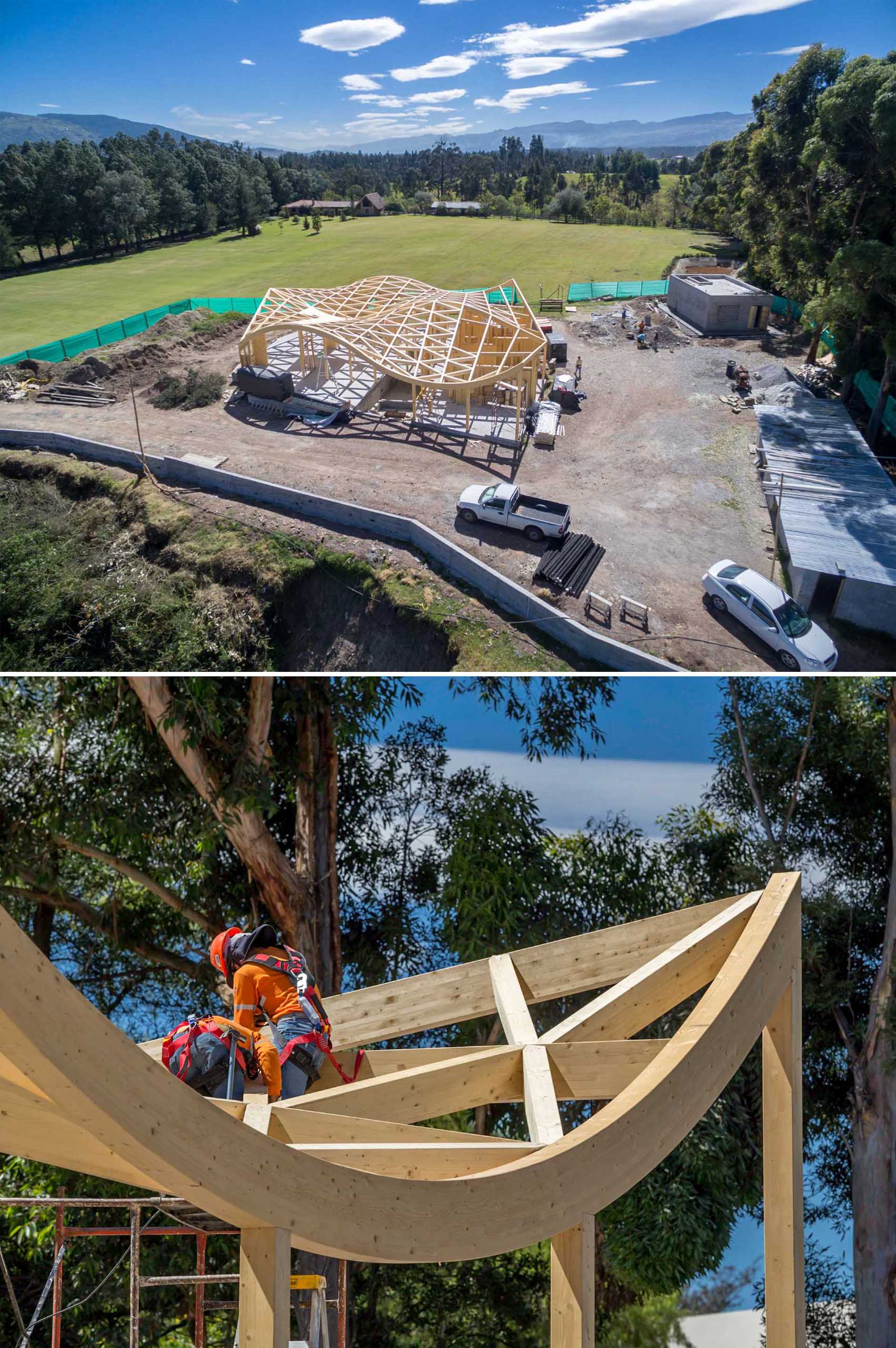 The construction of a wood house with a wavy roof.