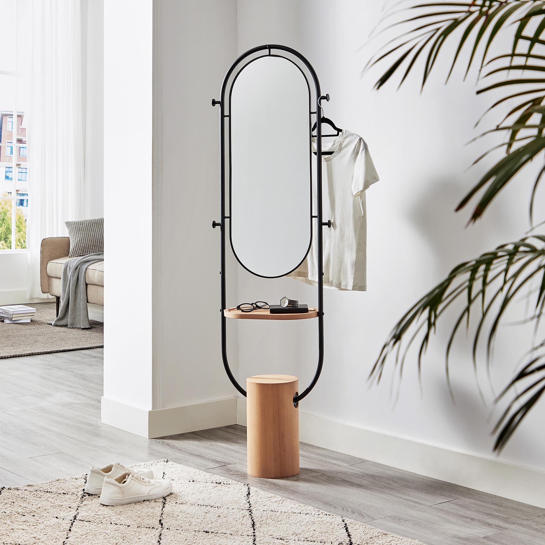 The Multifunctional Mirror, integrating a coat rack, a dressing mirror, a shoe mirror, and a storage tray into one unit, effectively solves the problems of common dressing mirrors being unable to reflect shoes and small-space dwellers having limited space for more furniture.