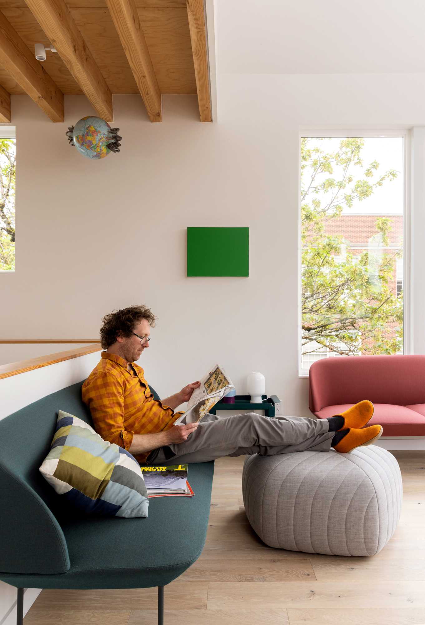 A modern living room with colorful furniture.