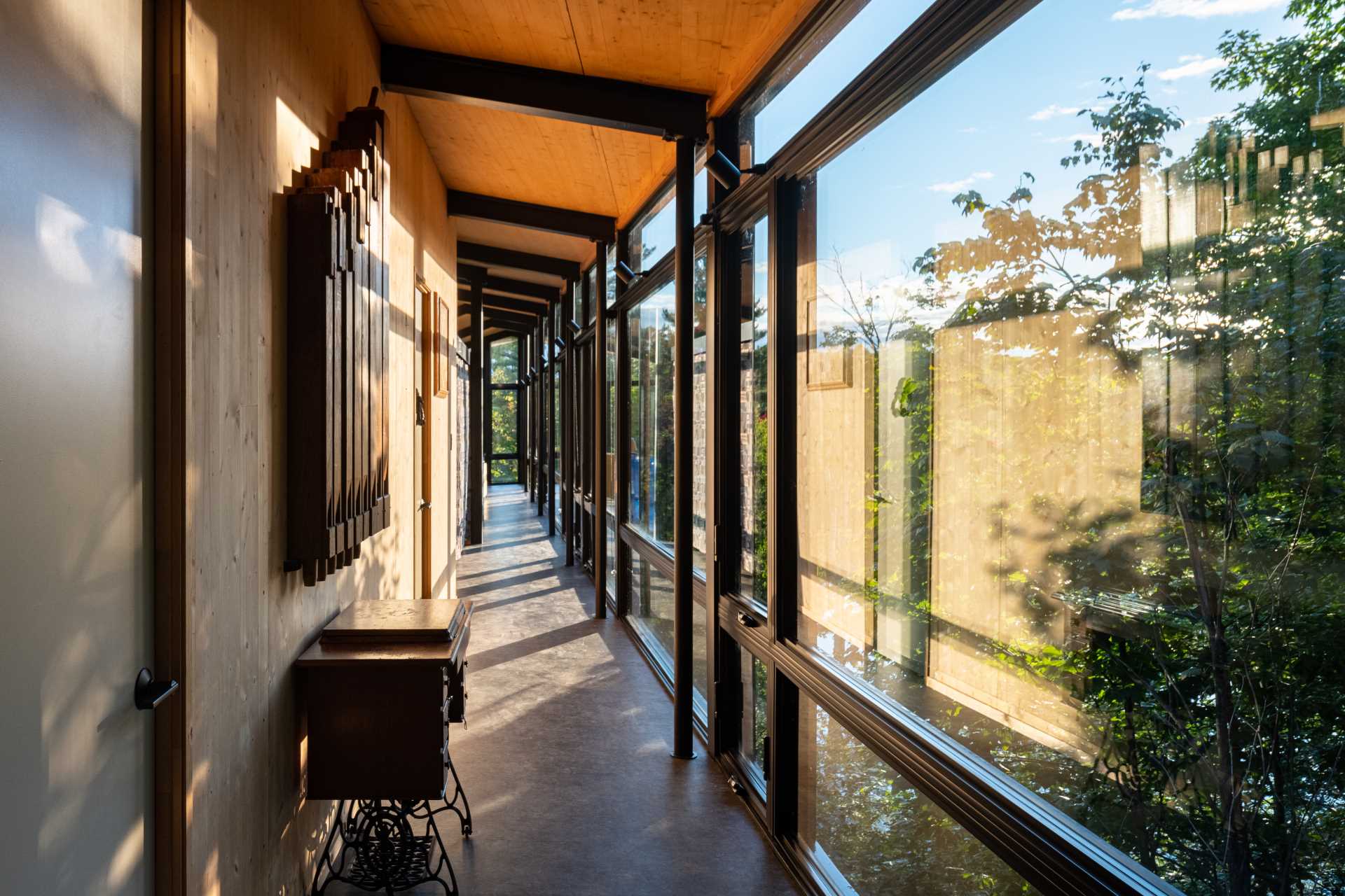 A modern cabin with black-framed windows.