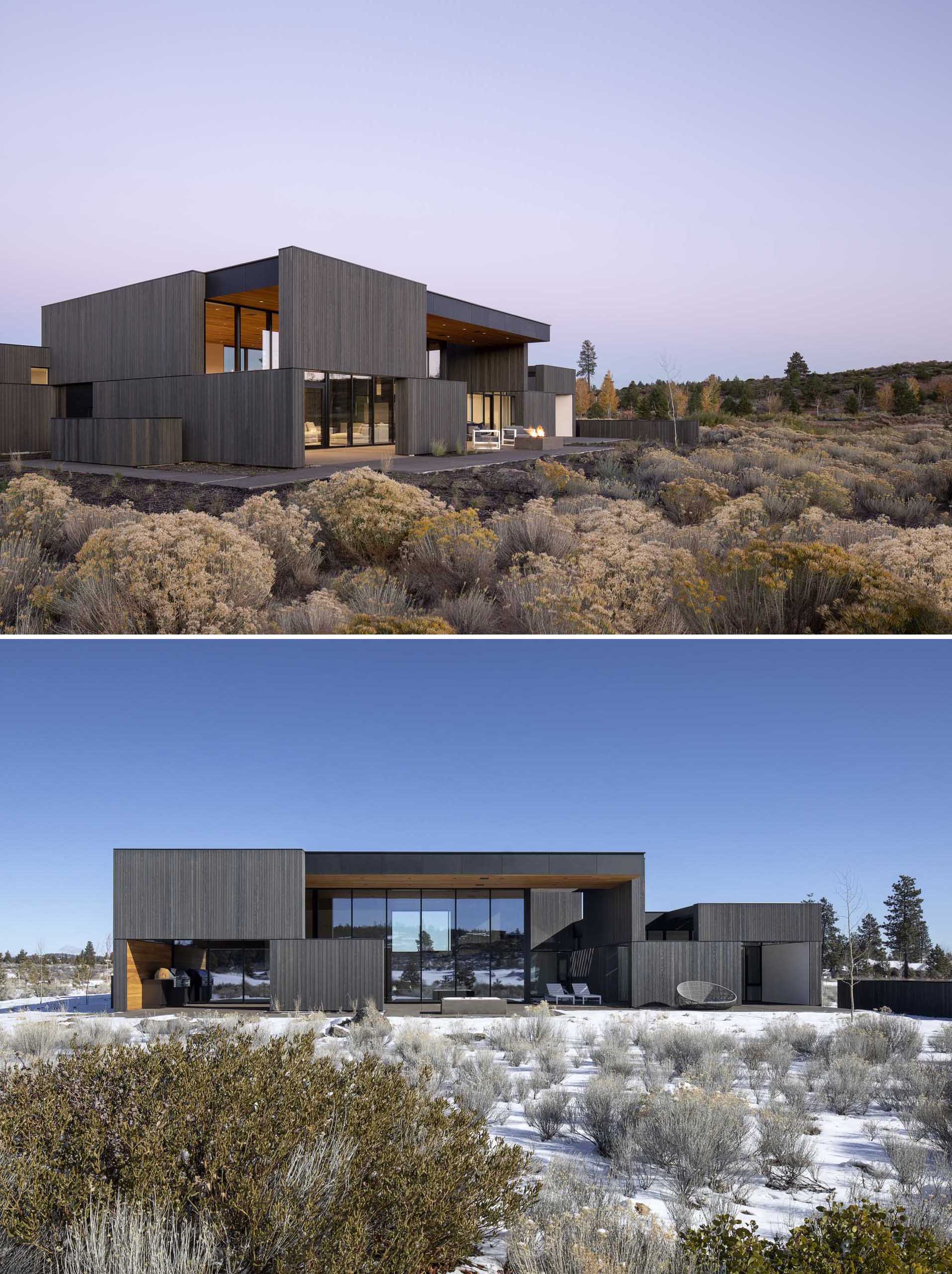 A modern house with dark cedar siding, high ceilings, and tall windows.