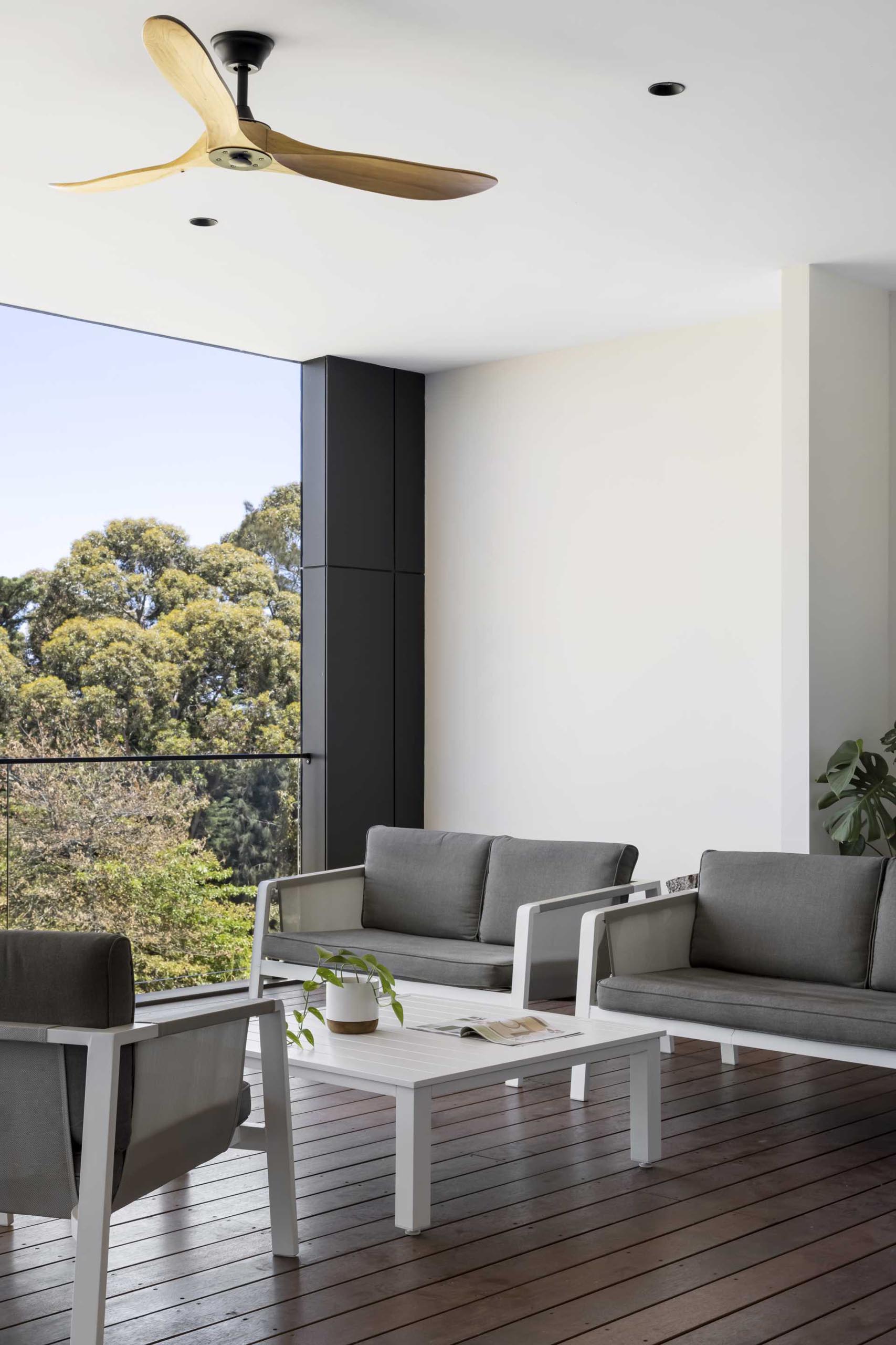 All of the social areas of the home open up to the covered deck that overlooks the bushland.