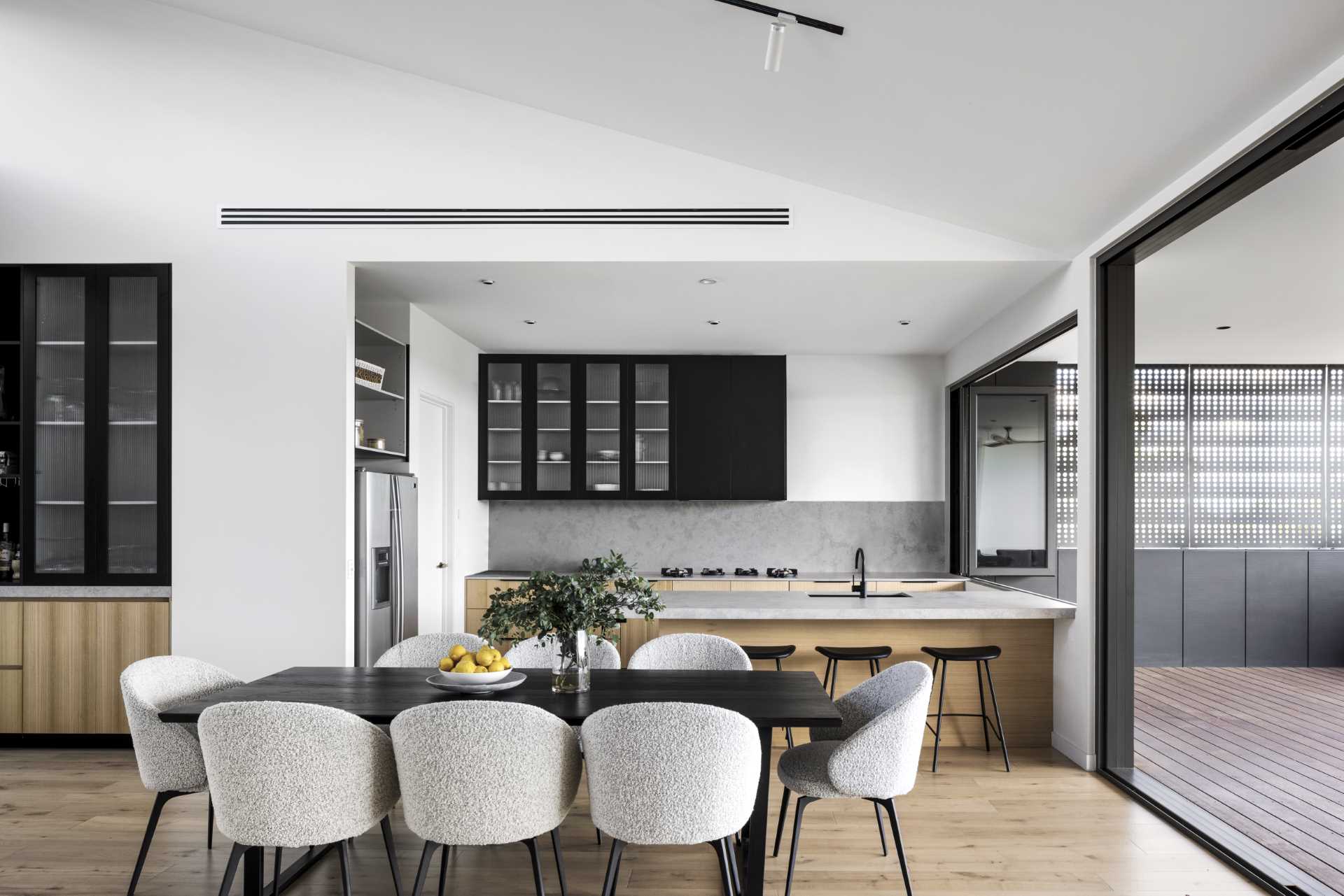 A modern open plan dining area and kitchen.