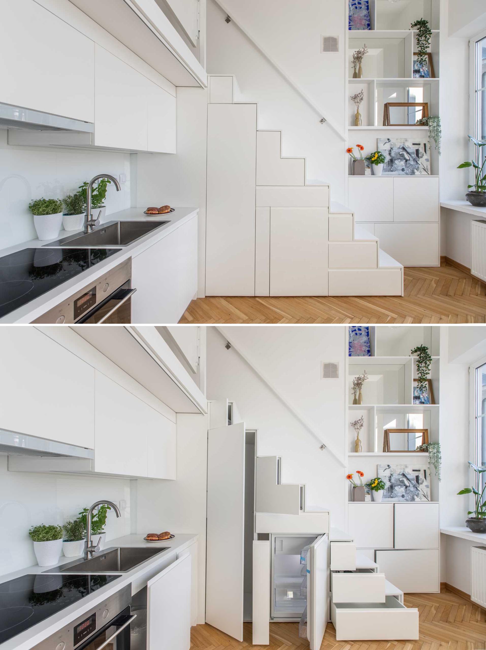 A pantry, drawers, and a small fridge are also included within the cabinets under the stairs.