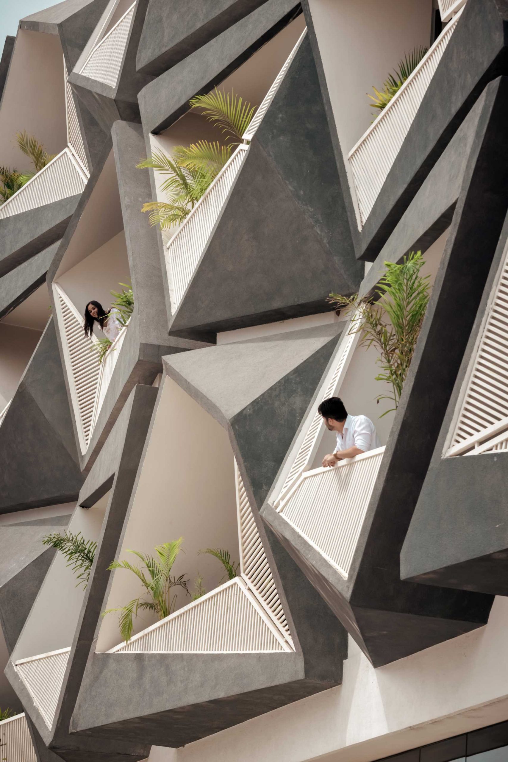 These balconies, which protrude away from the building, each have their own unique design, adding interest to the facade.