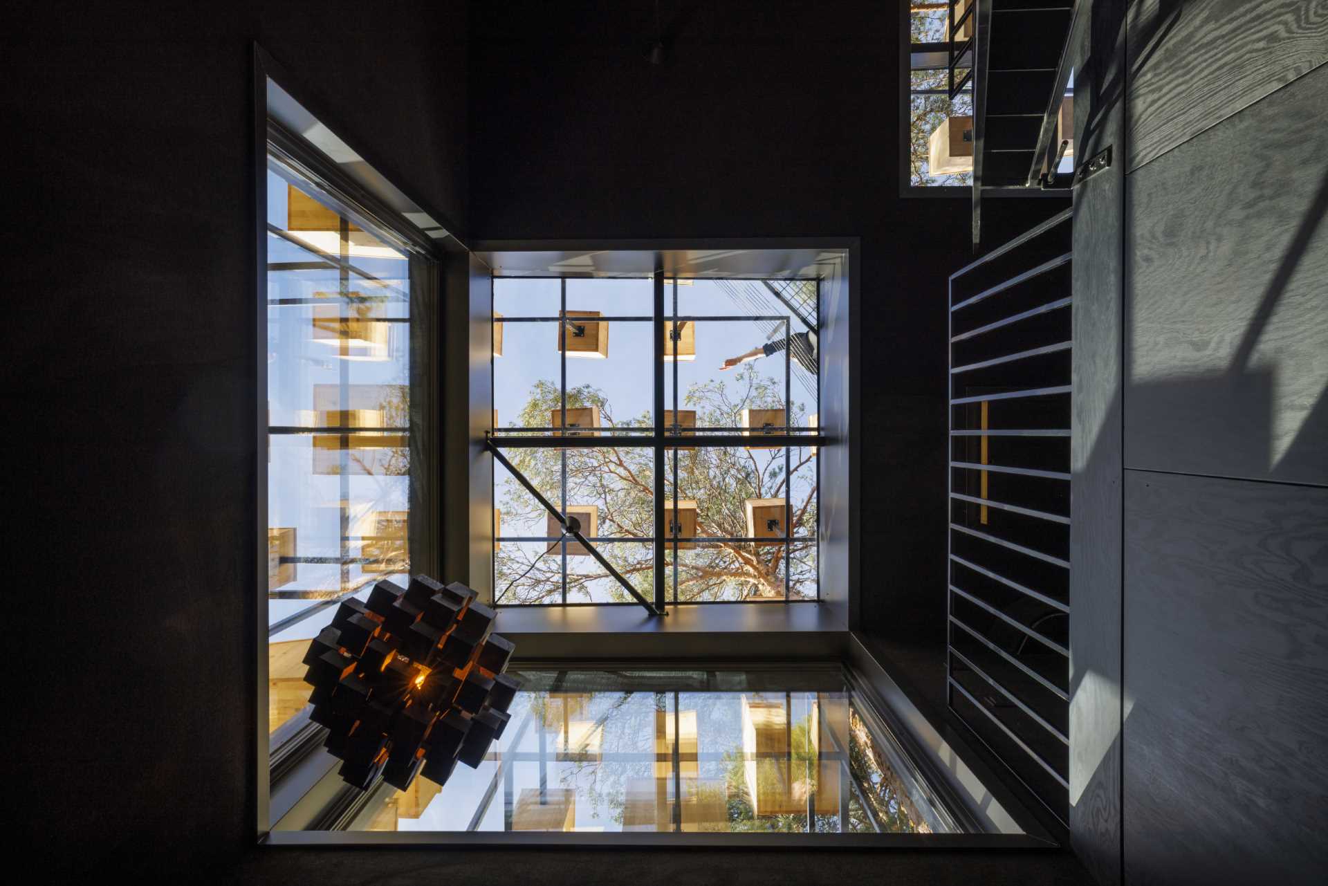 A hotel room in Sweden is covered in 350 bird houses.