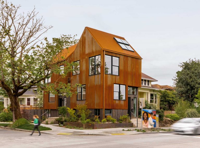 A Rusted Metal Exterior Allows This Townhouse To Stand Out On The Corner