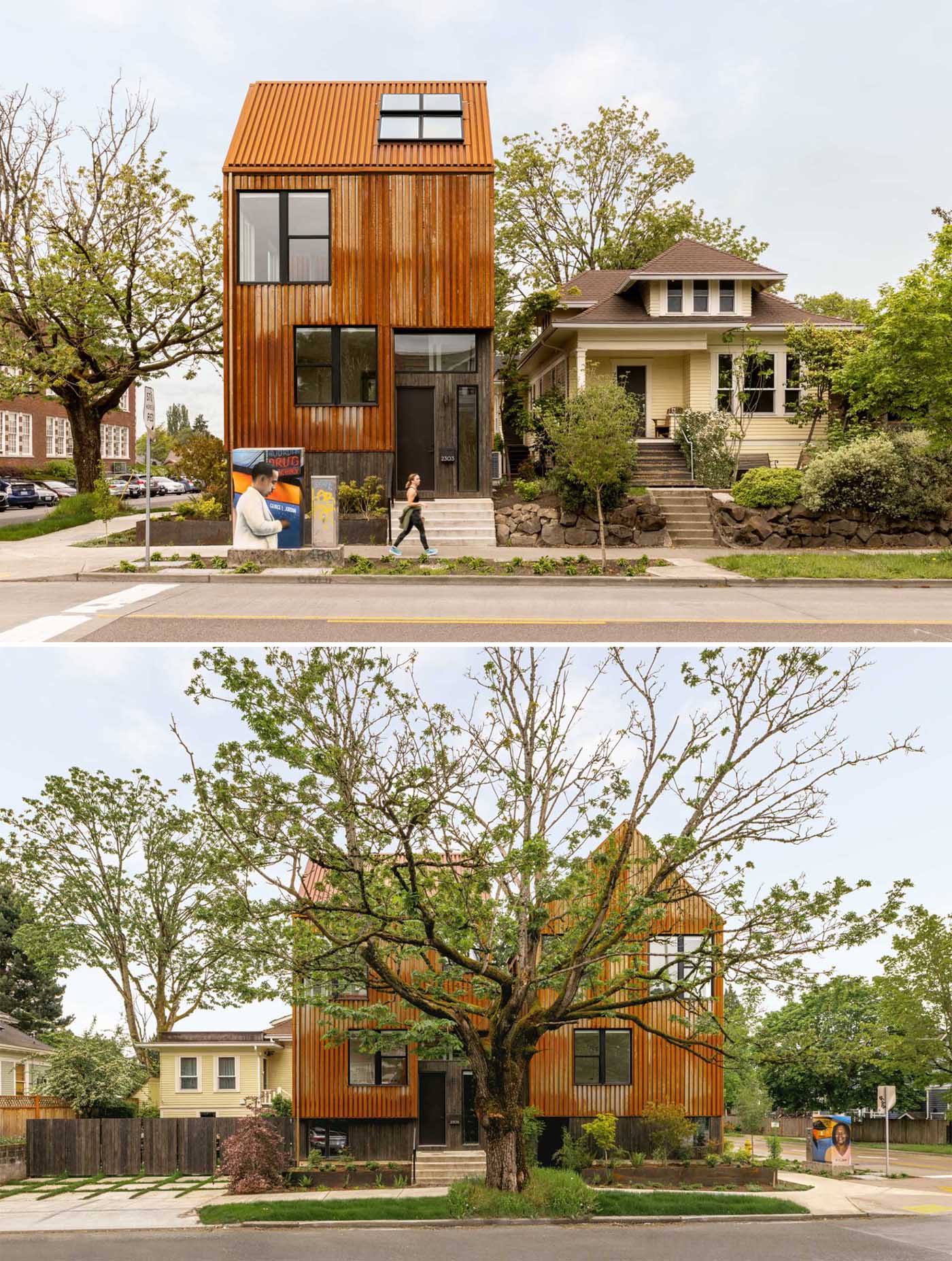 A modern townhouse on a corner, has an exterior clad in rusted corten steel.