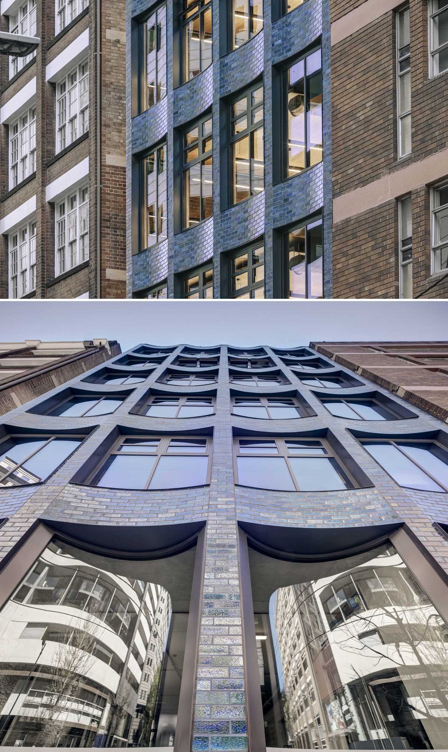 A commercial building with aquamarine glazed bricks and a scalloped facade.