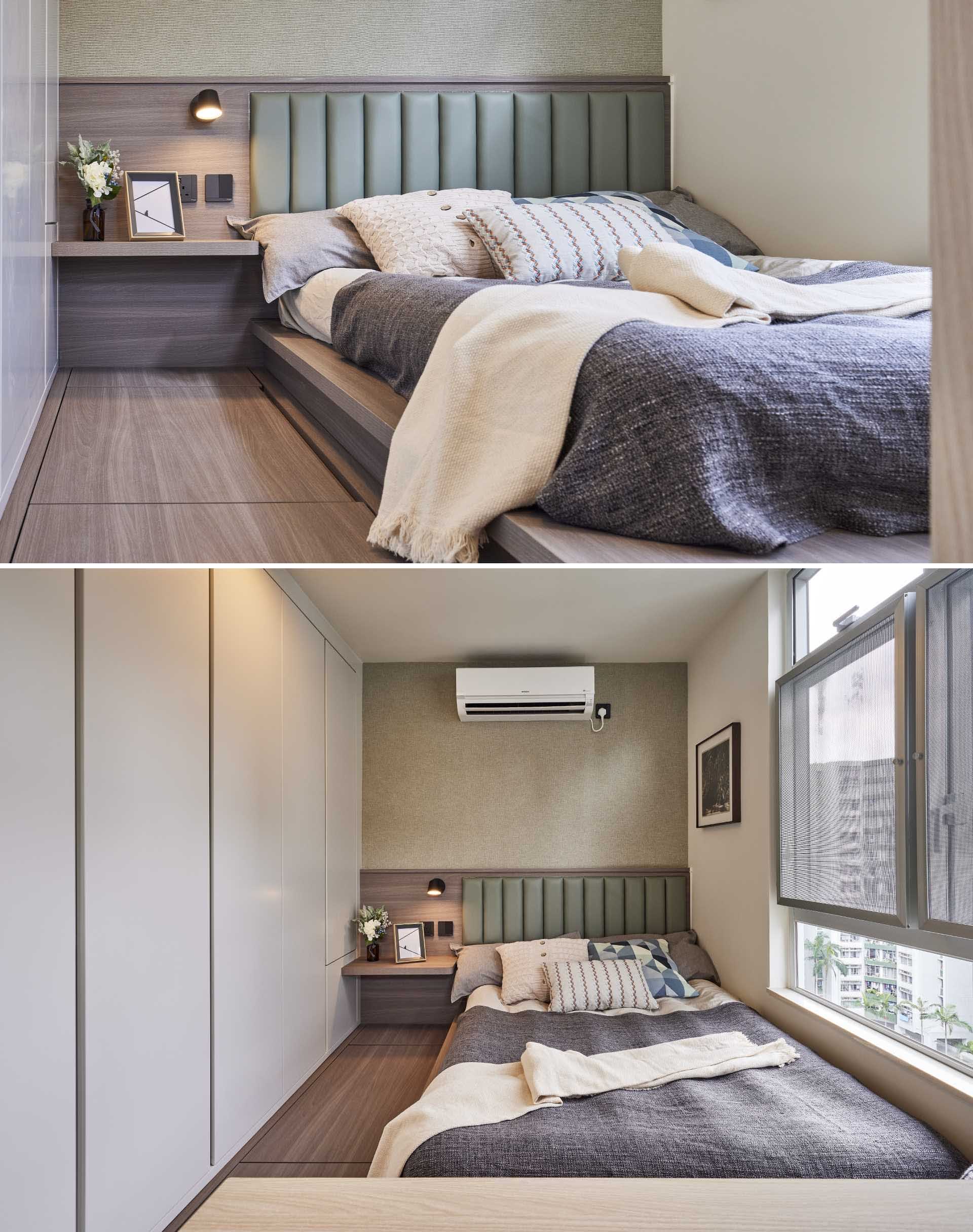 This small bedroom includes a built-in bed frame and bedside table with a green leather headboard, textured wallpaper, a wall of storage. There's also additional storage within the bed platform.