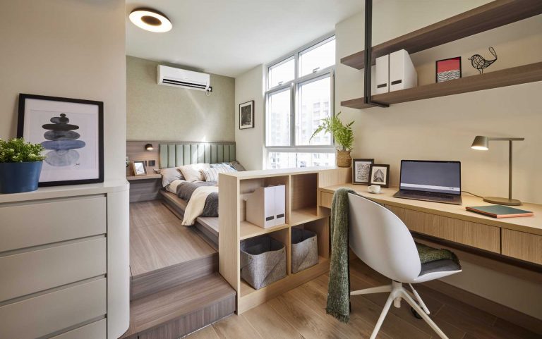 A Raised Bed Creates A Separate Space From The Home Office In This Apartment Bedroom
