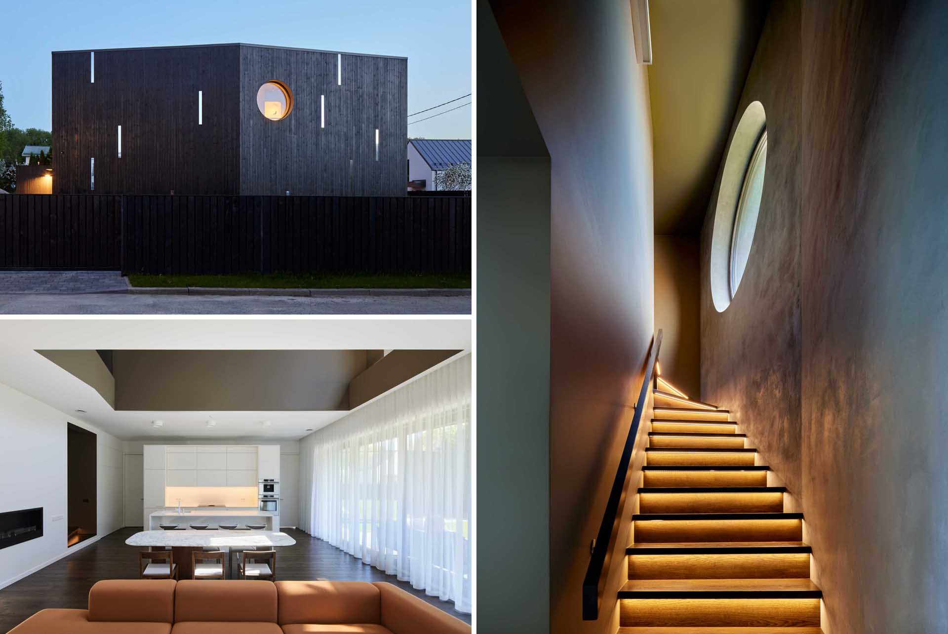 A modern house with a dark wood exterior, includes a staircase with hidden LED lighting.