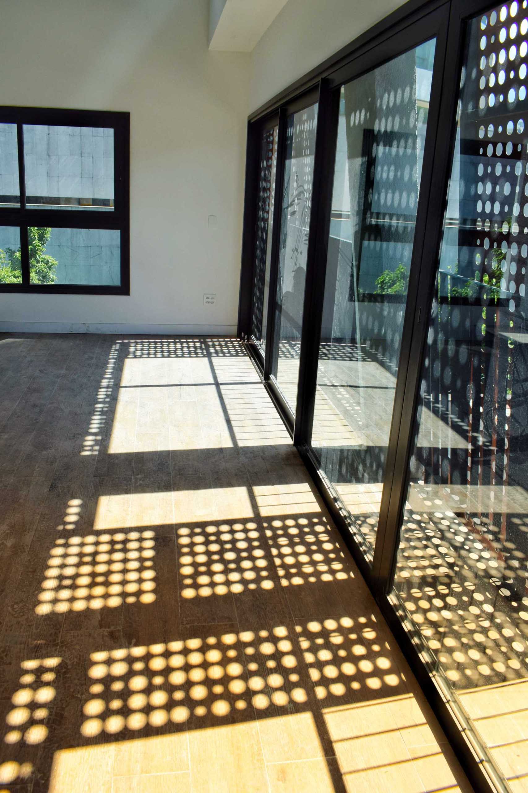 Perforated metal panels create a unique shadow design.
