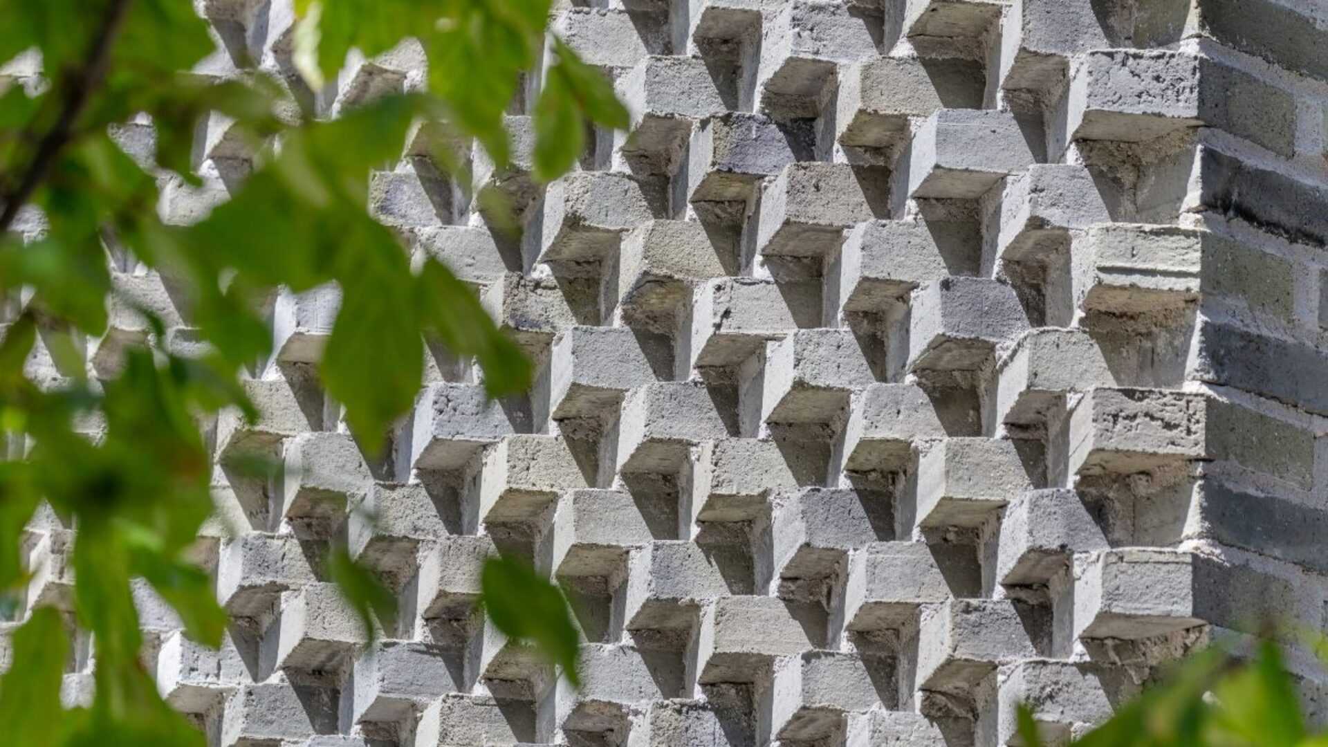 A modern house with saw tooth brick.