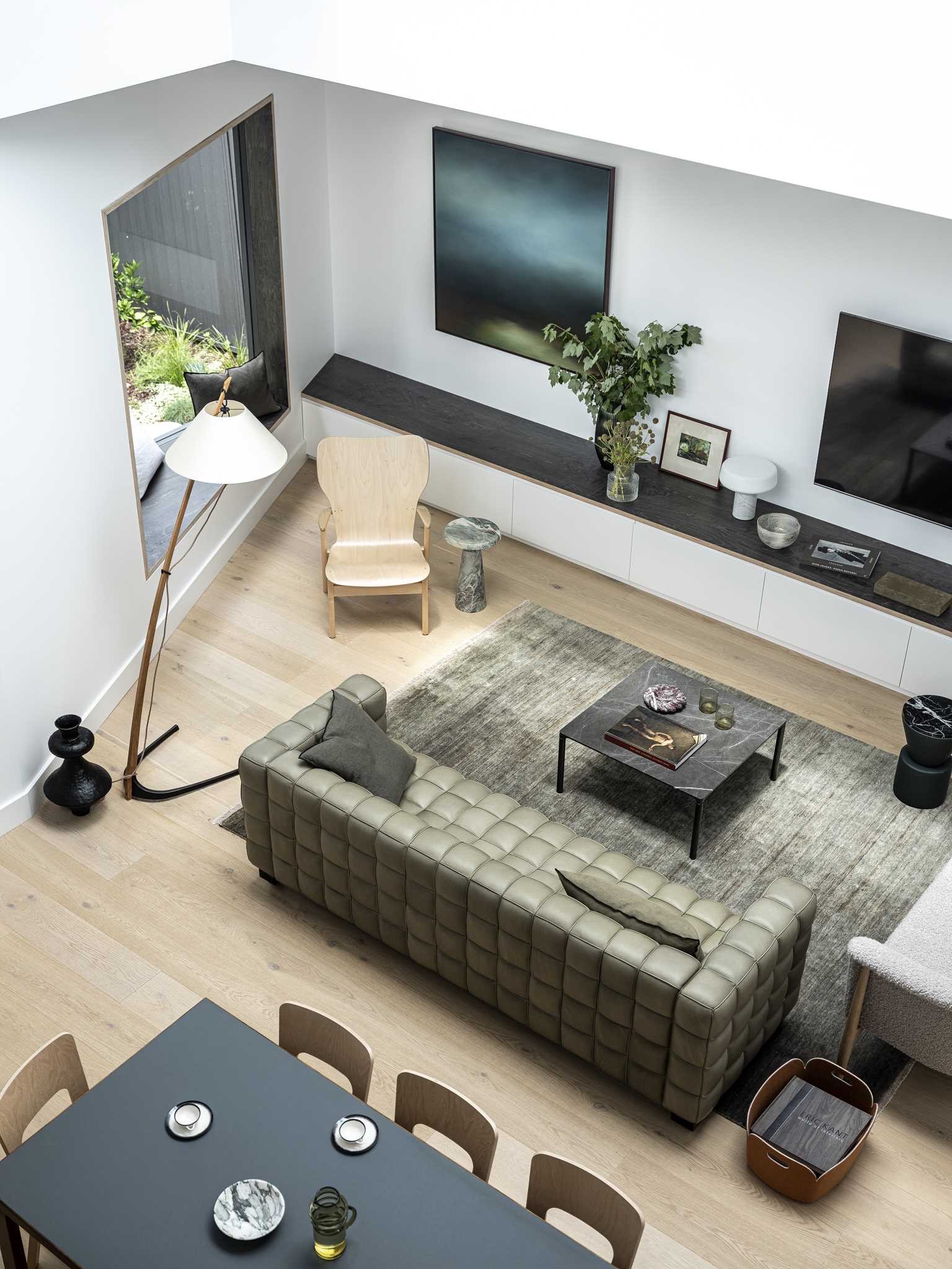 A modern living room and dining area layout from above.