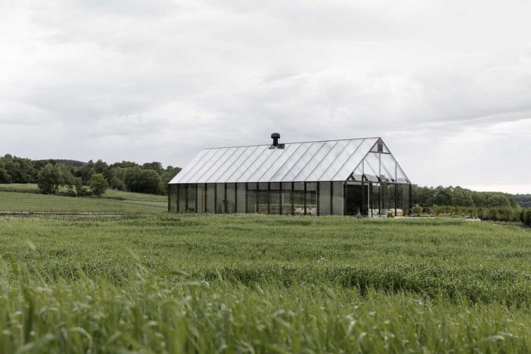 This Glass House Acts As The Entrance To A Partially Underground Restaurant