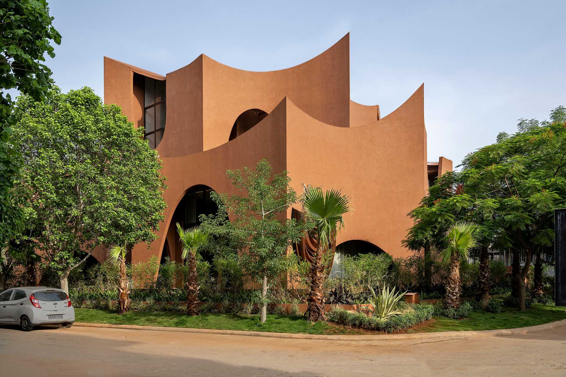 A sculptural house with arches scattered throughout its design